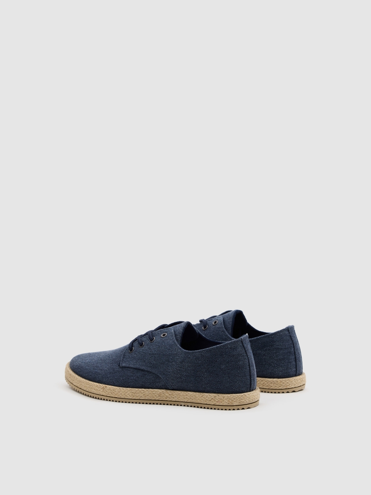 Lona tejido punto cordones azul vista trasera 45º