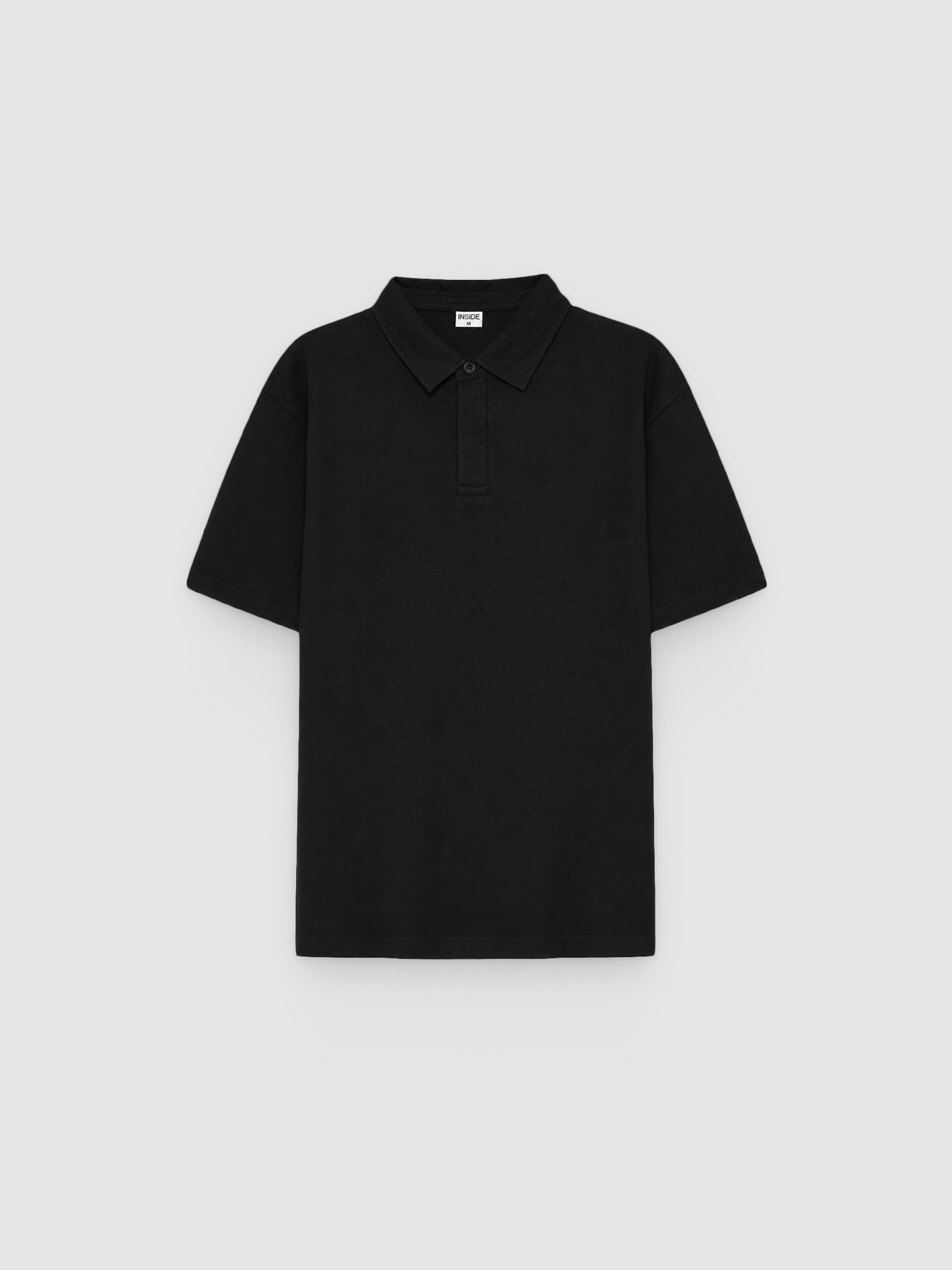 Polo piqué básico negro vista media frontal