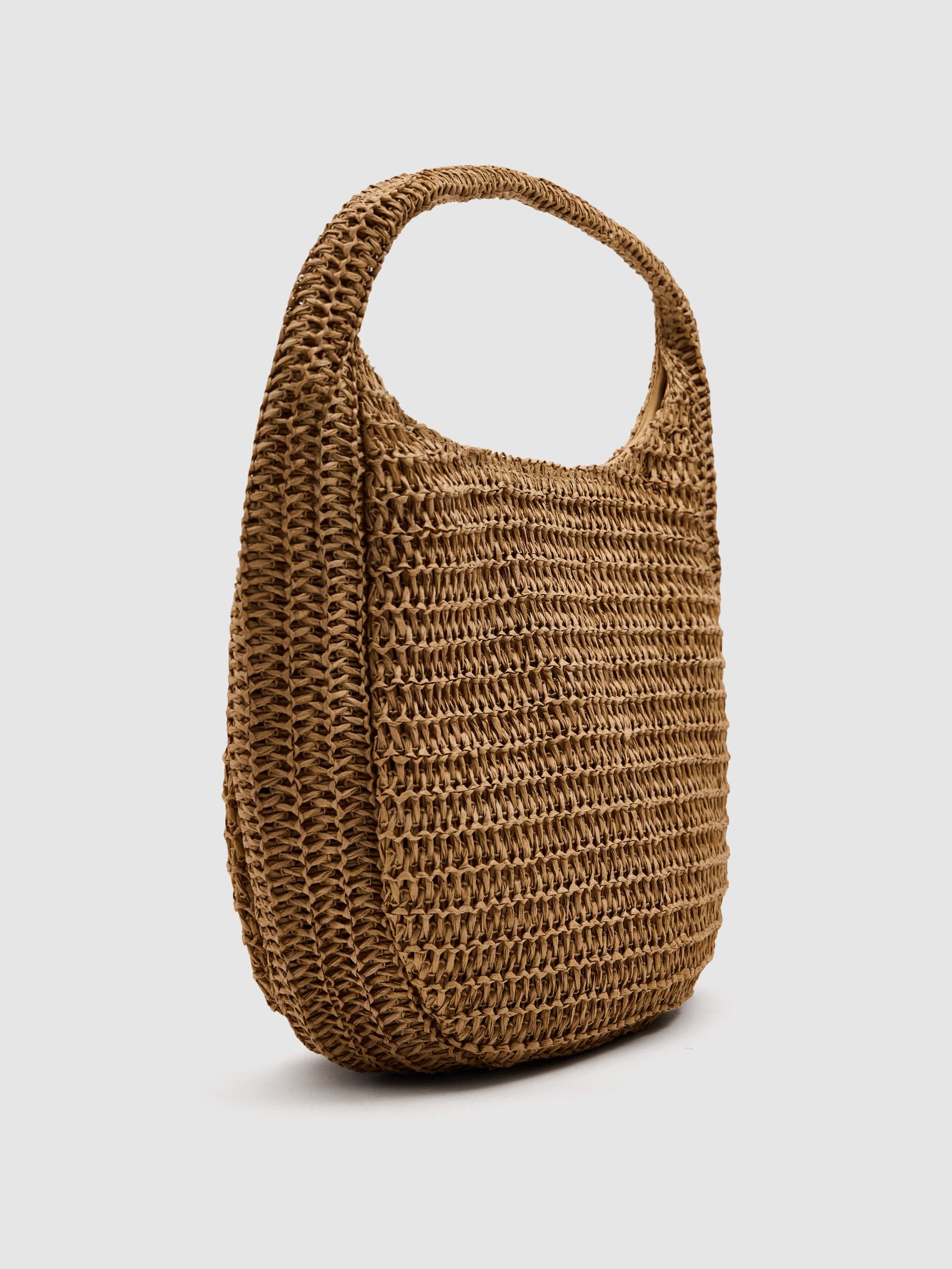 Bolsa de ombro de ráfia trançada