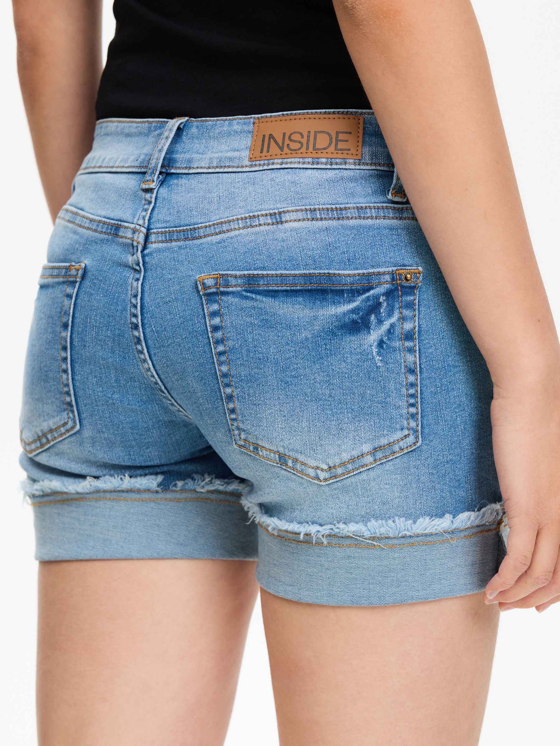 Frayed hem denim shorts blue middle front view