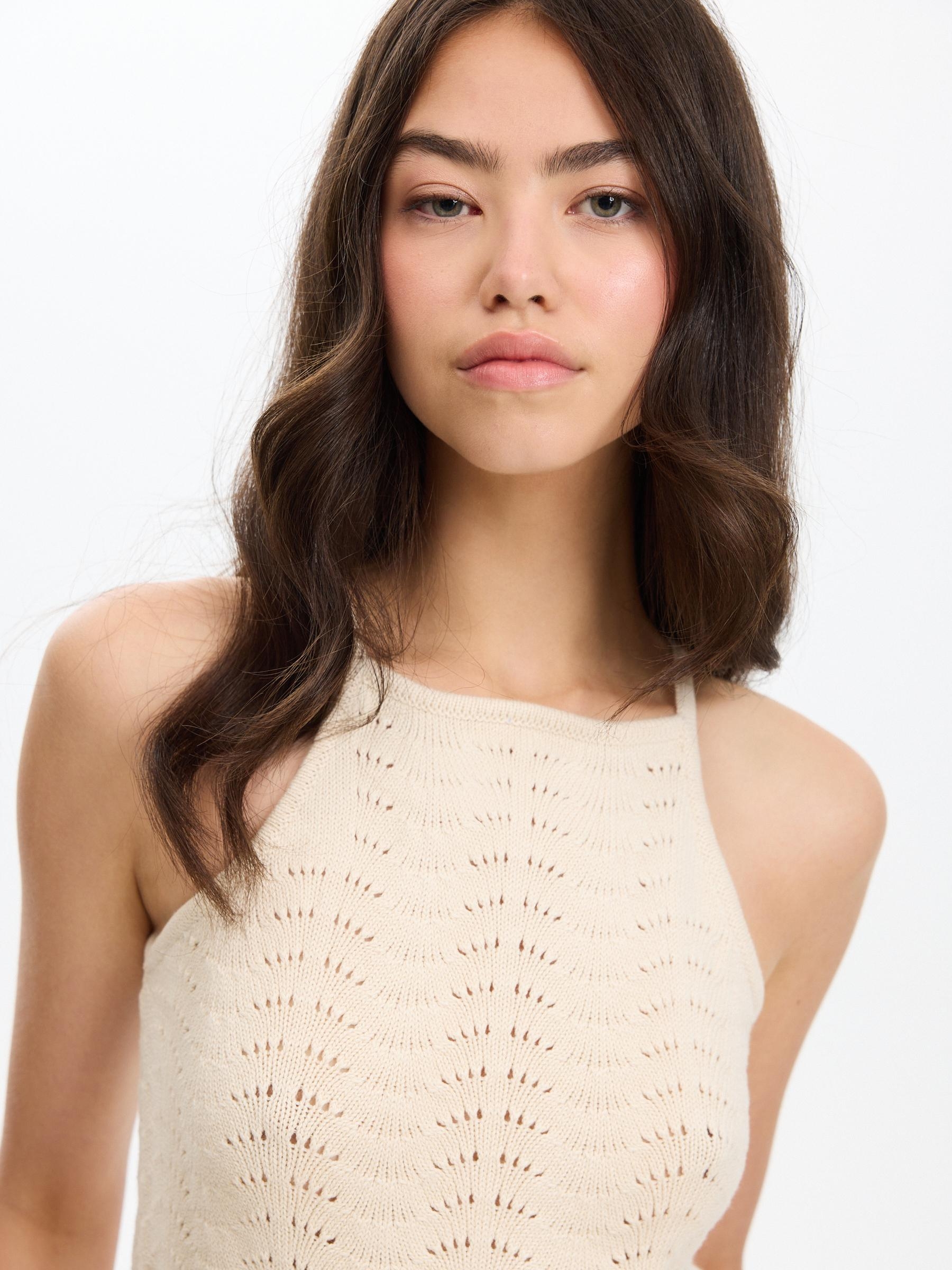 Openwork knitted halter top off white middle front view