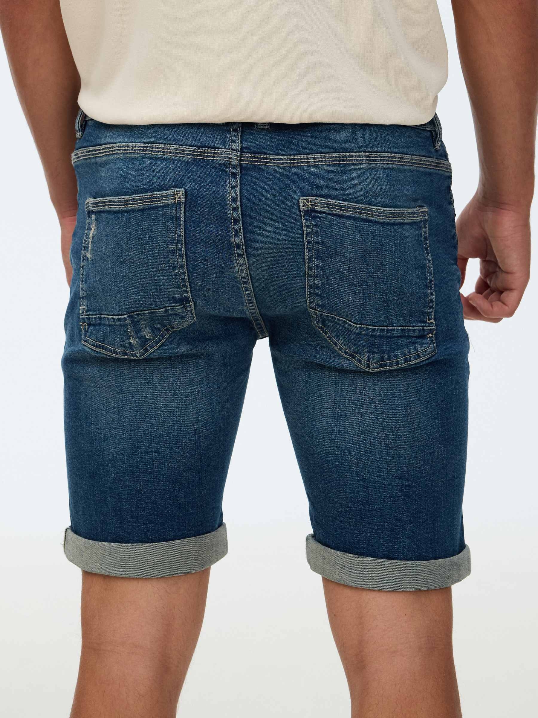 Calça jeans skinny azul vista meia frontal