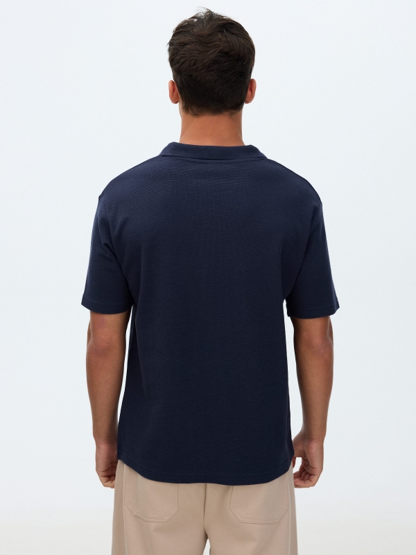 Plain short-sleeved polo shirt navy middle back view