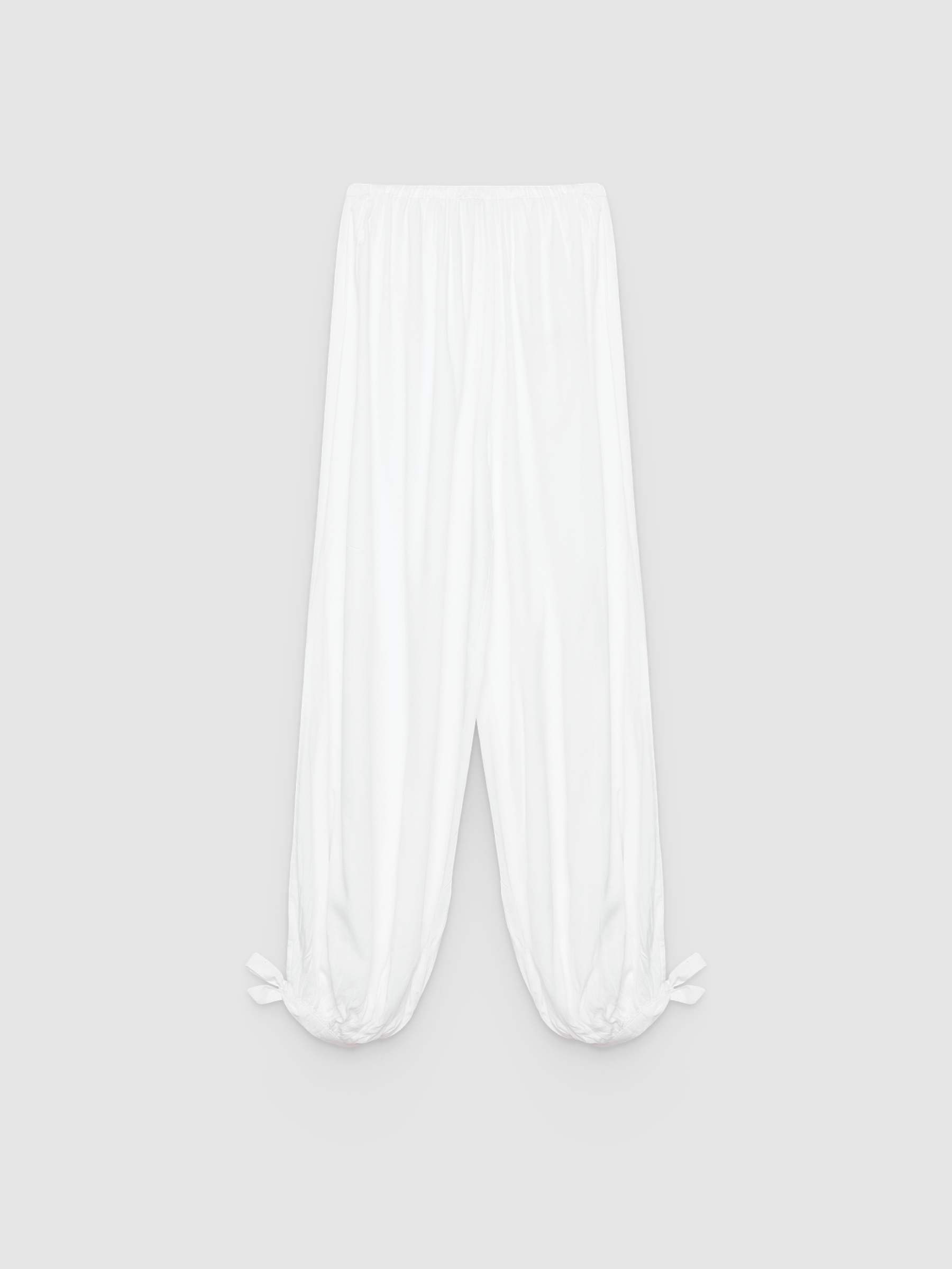  High-waisted baggy pants with bows white front view