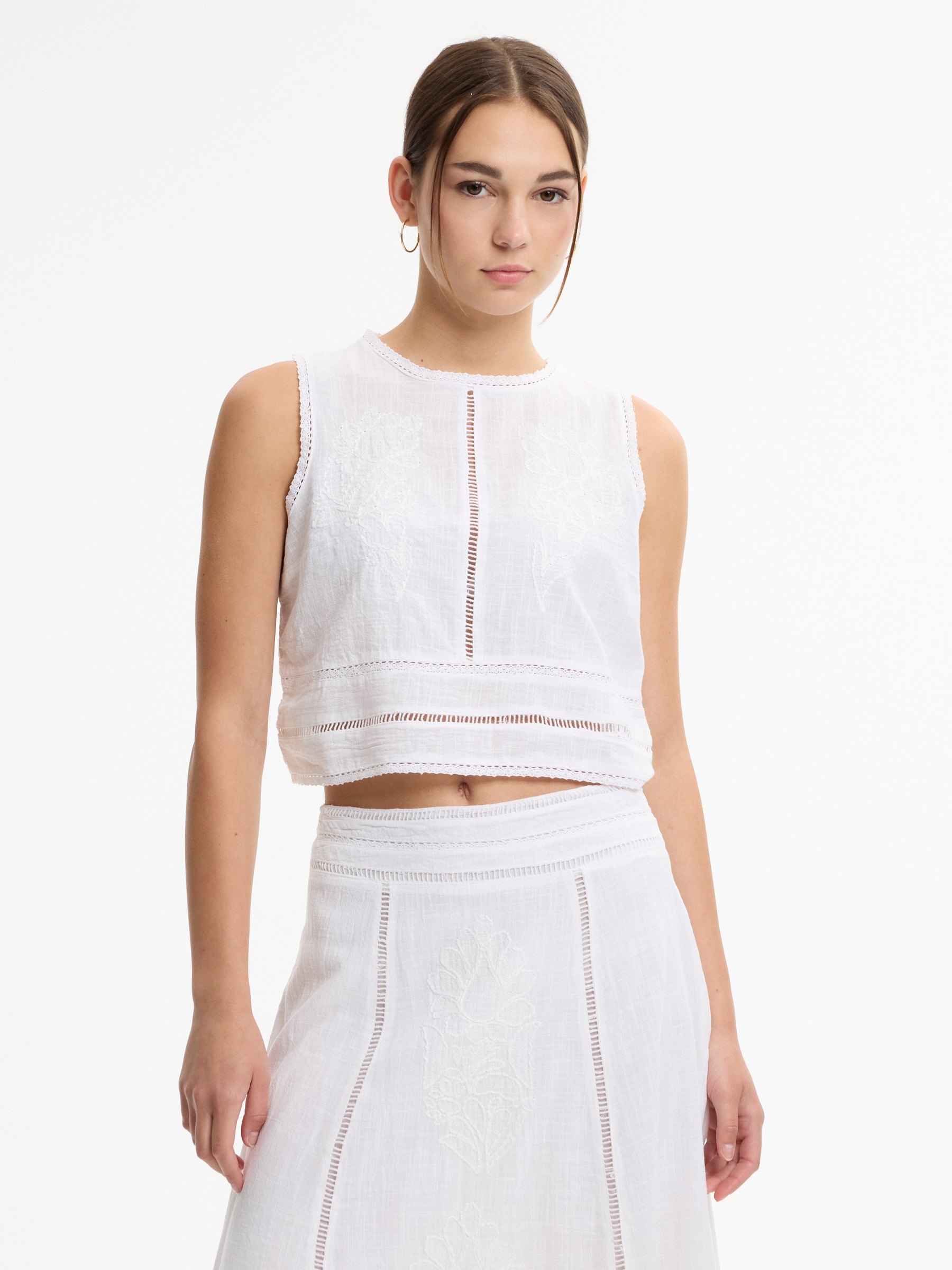 Embroidered top white middle front view