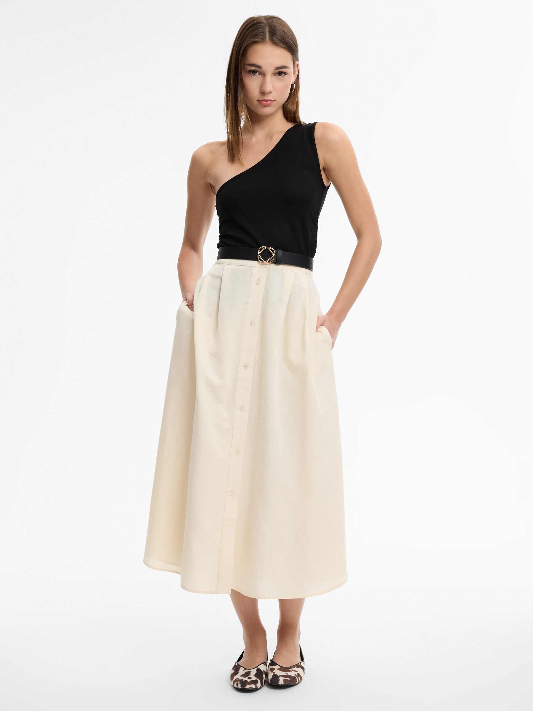 Slim asymmetrical draped top black middle front view