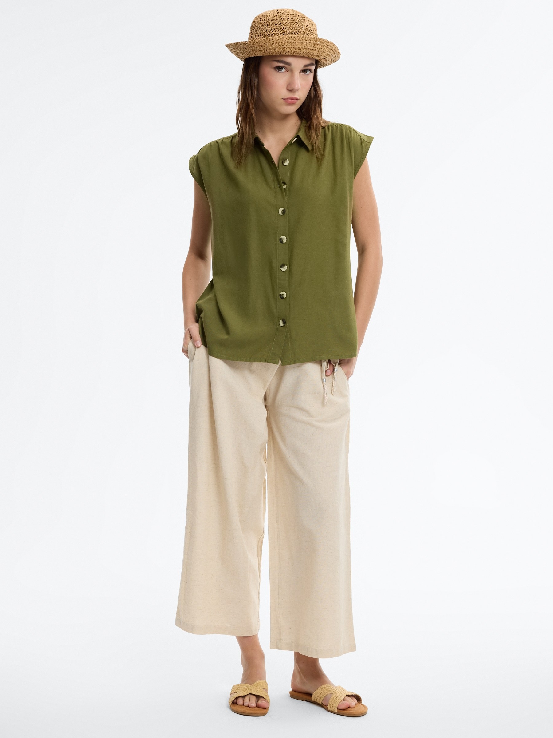 Sleeveless linen shirt green middle front view