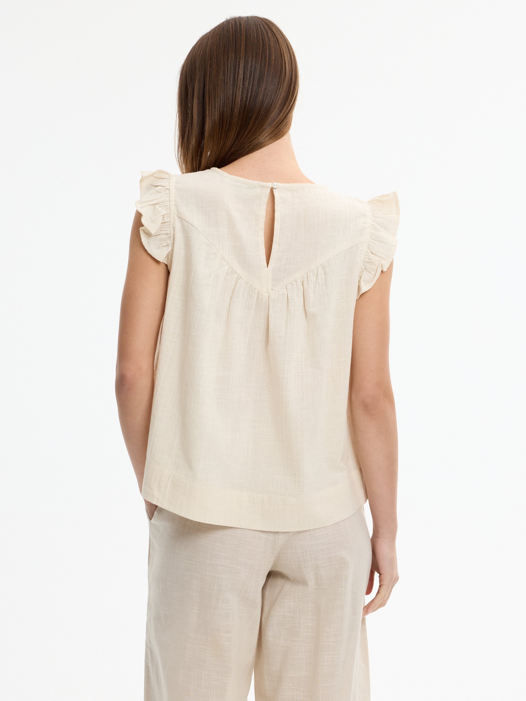 Ruffled blouse crochet linen buttons off white middle front view