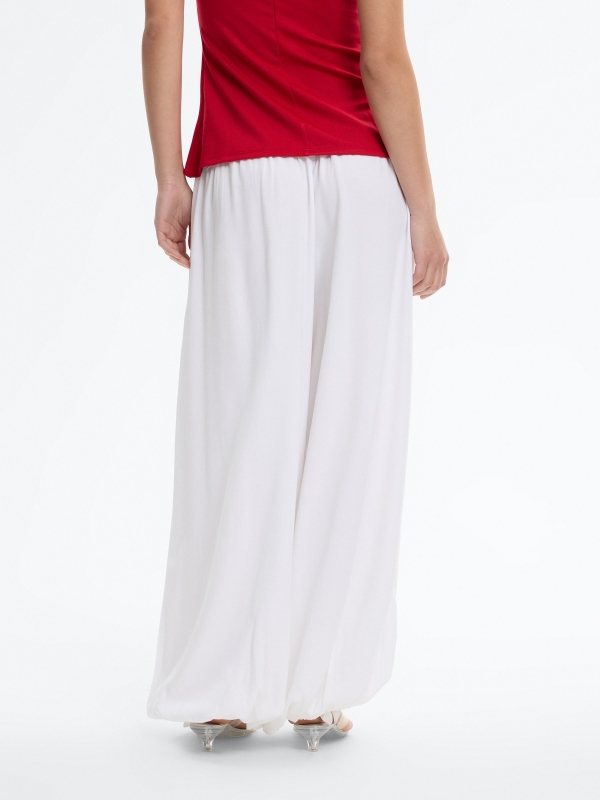 High-waisted baggy pants with bows white middle back view
