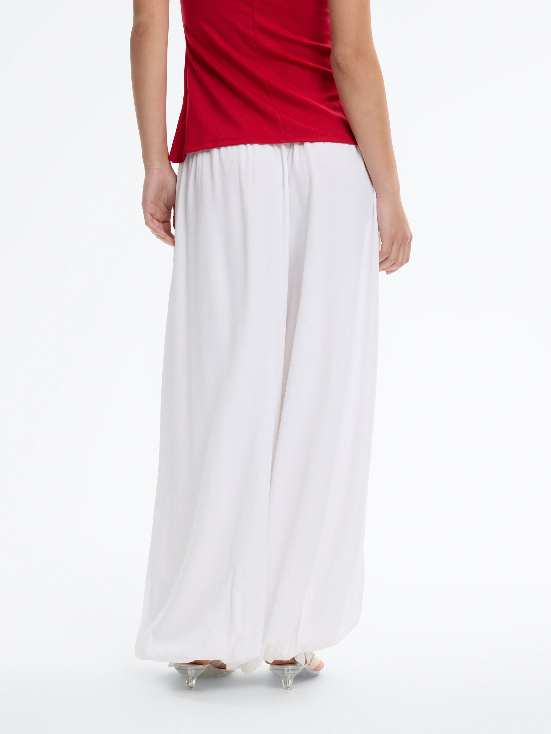 High-waisted baggy pants with bows white front view