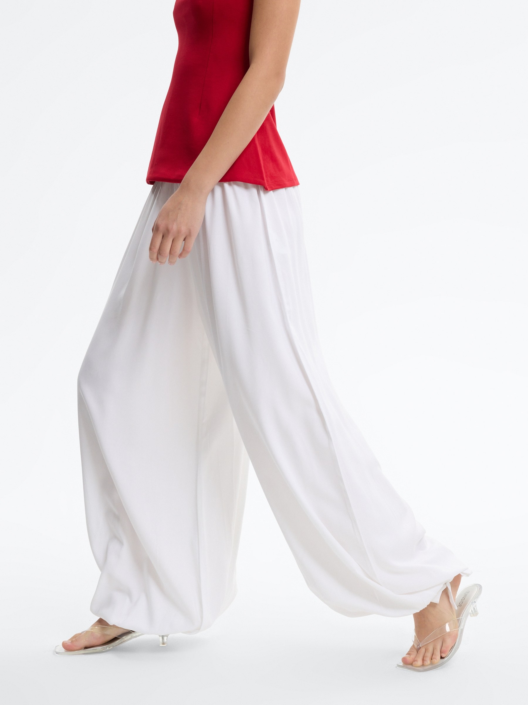 High-waisted baggy pants with bows white front view