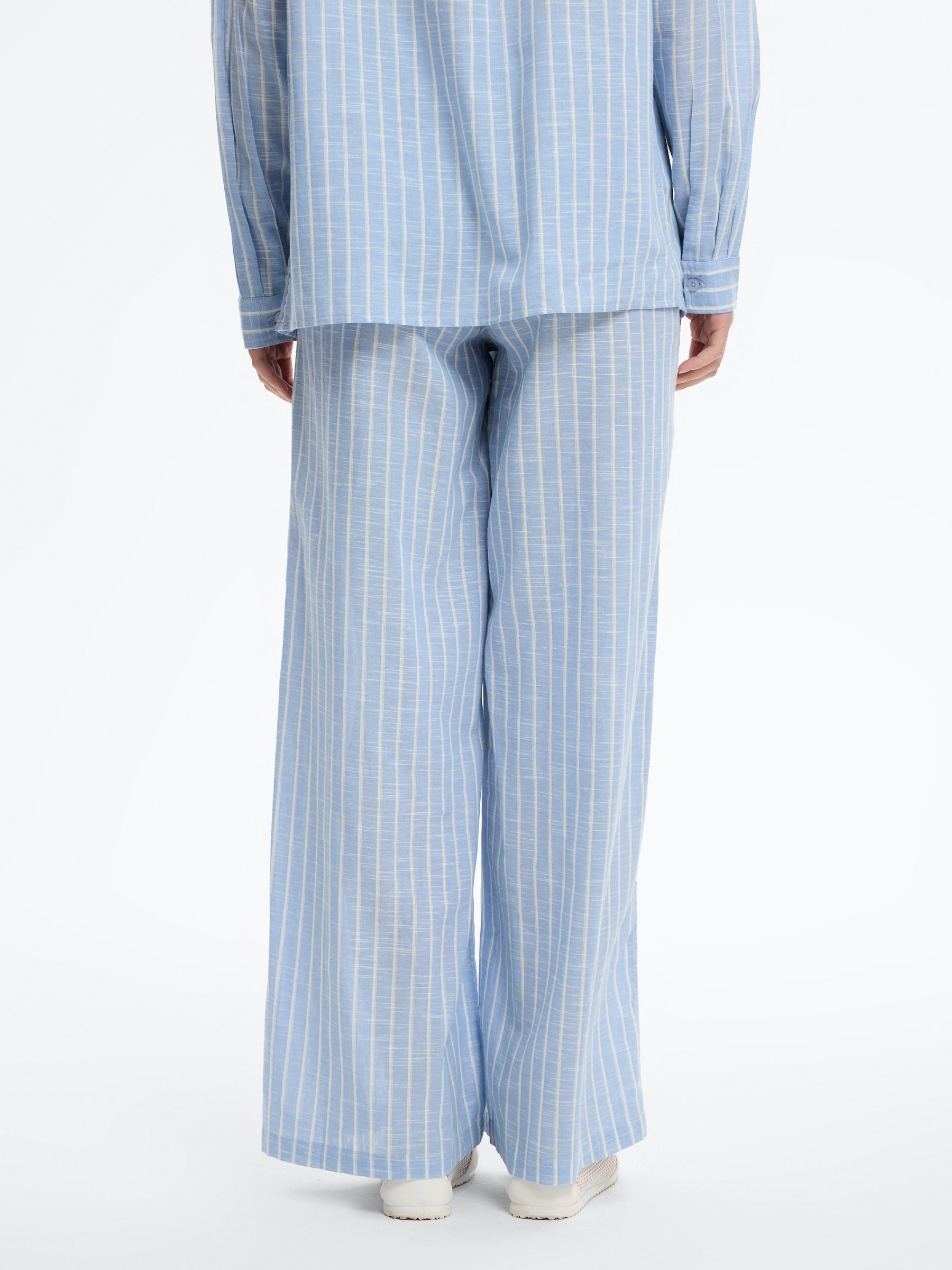 High-waisted striped wide-leg pants sky blue front view