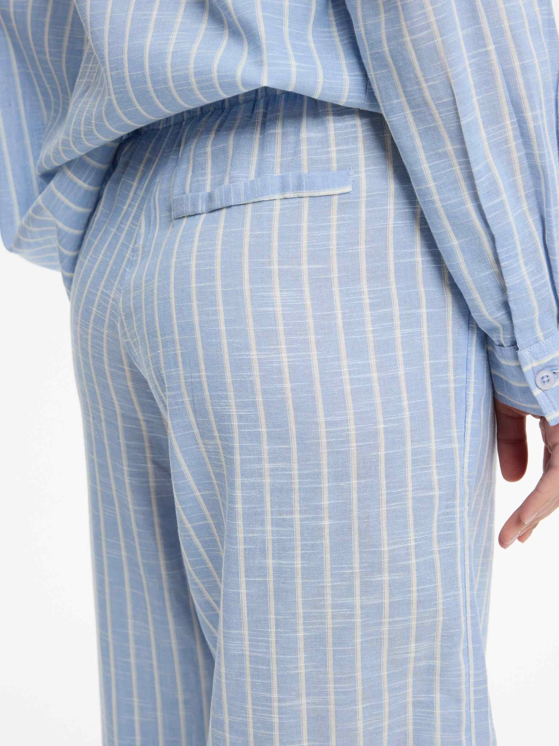 High-waisted striped wide-leg pants sky blue front view