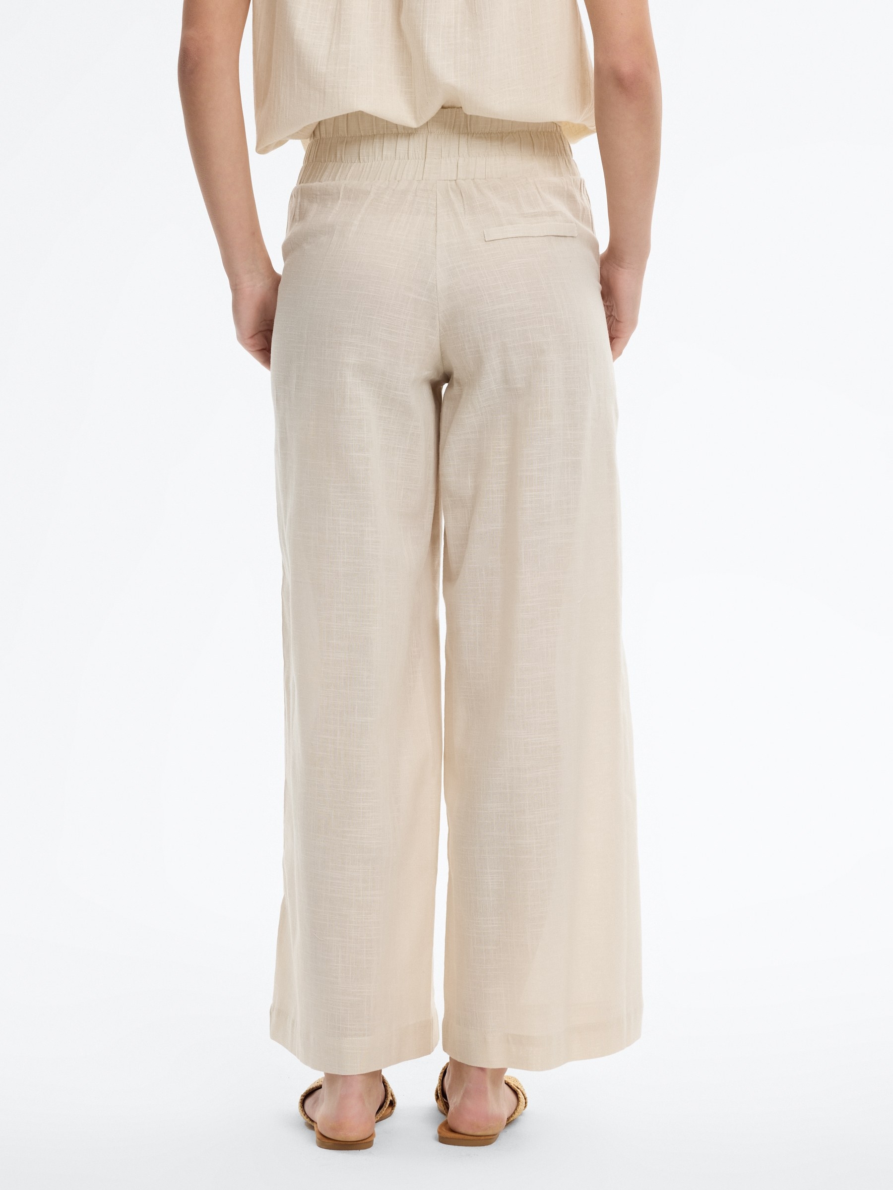 Pantalón palazzo lino elástico blanco roto vista general frontal