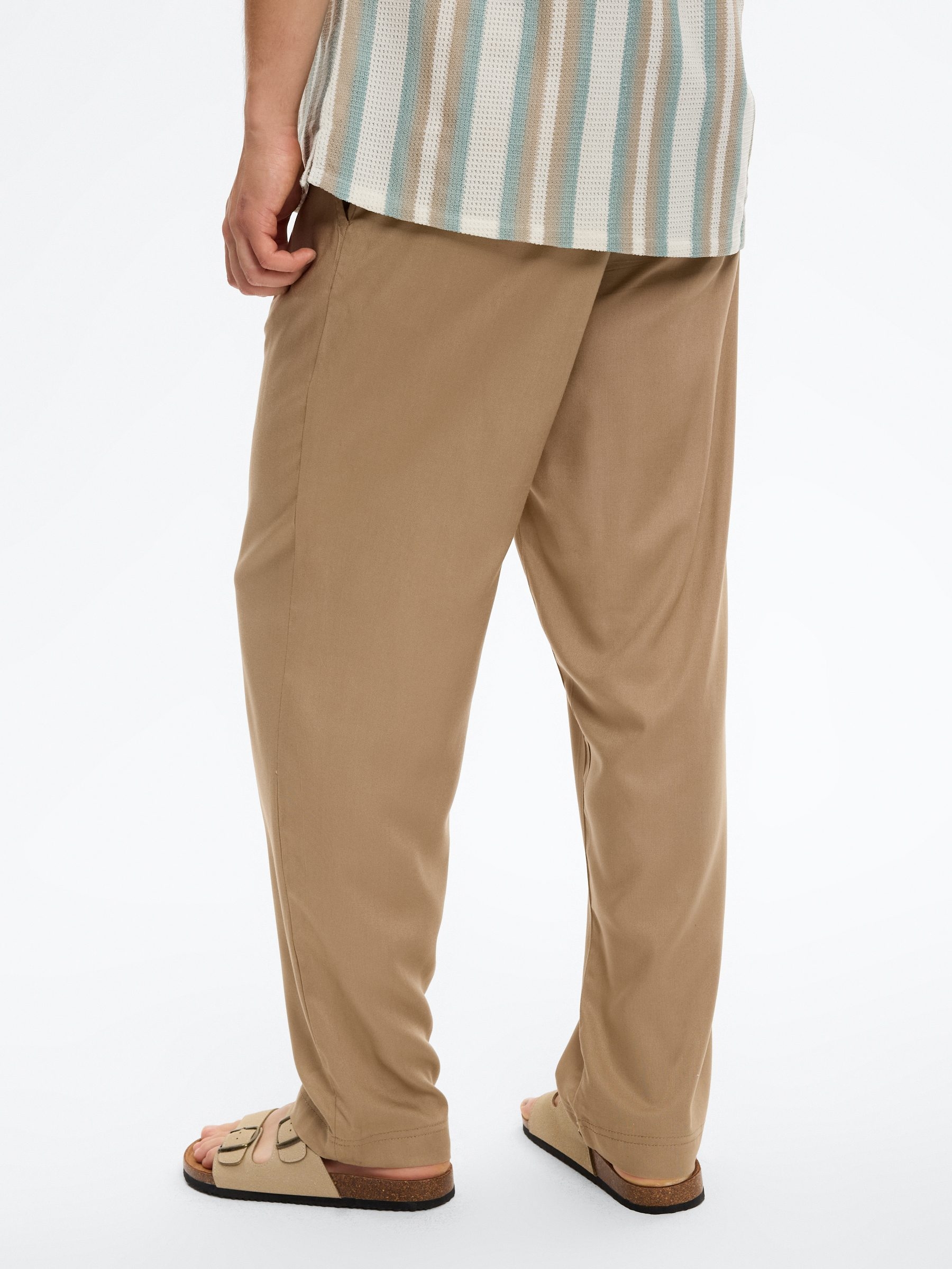  High-waisted linen joggers beige front view