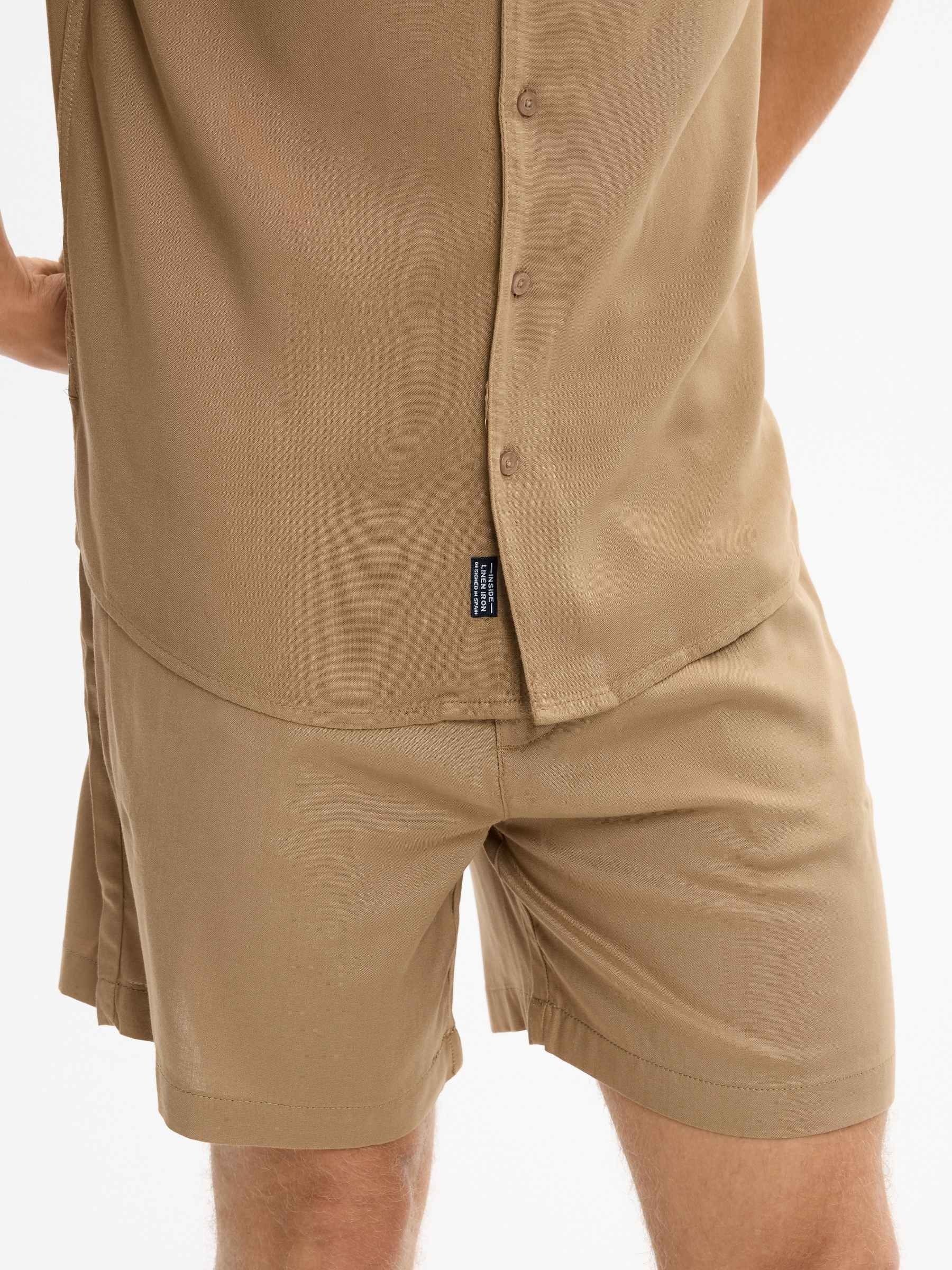 High-waisted chino shorts beige middle front view
