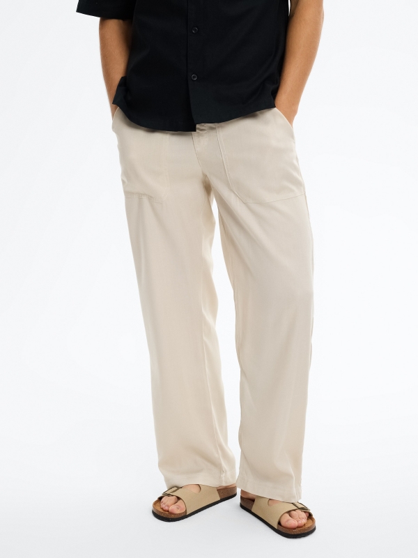 Jogger de linho com cintura elástica crua vista meia frontal