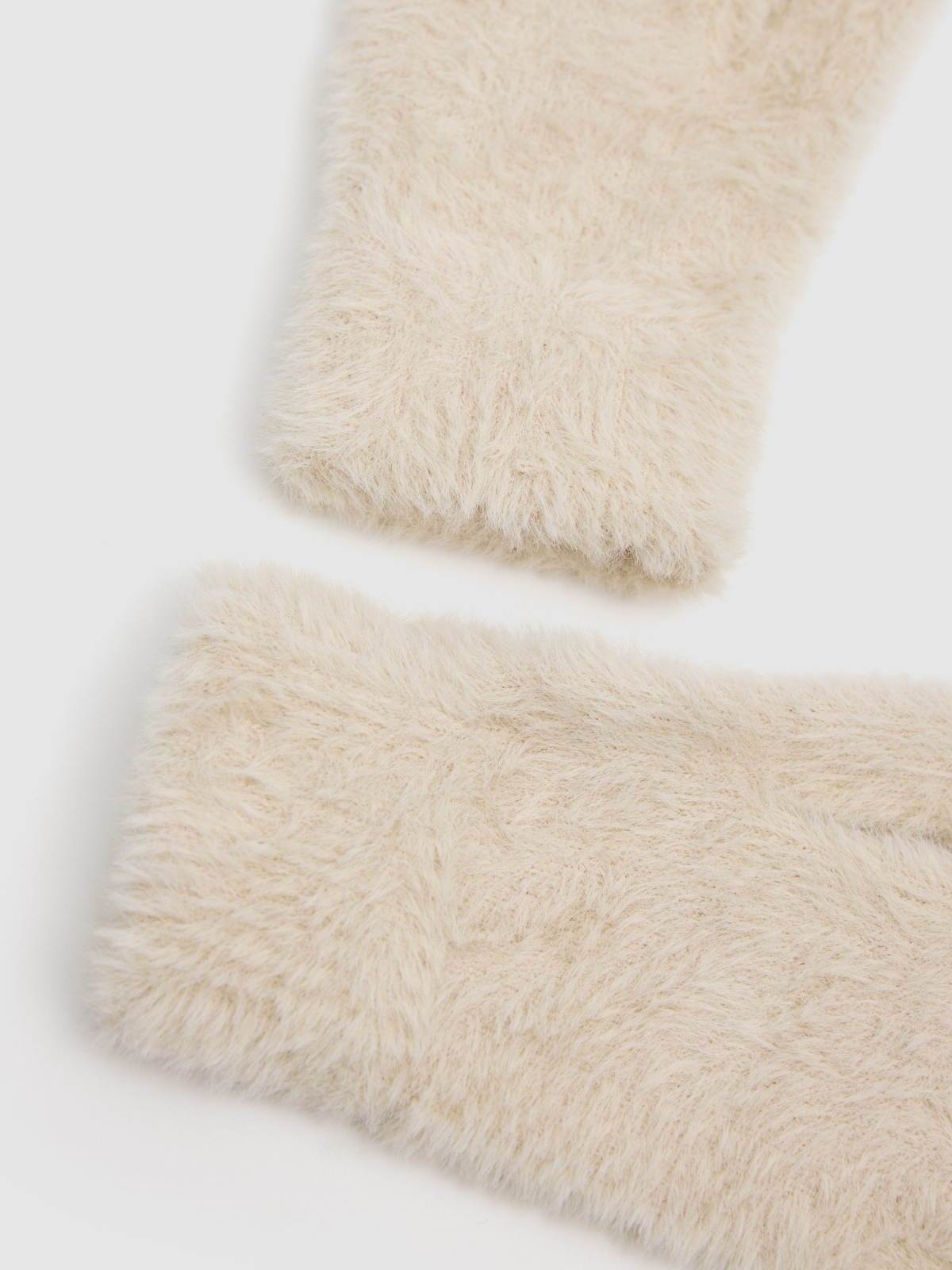 White fur gloves beige detail view