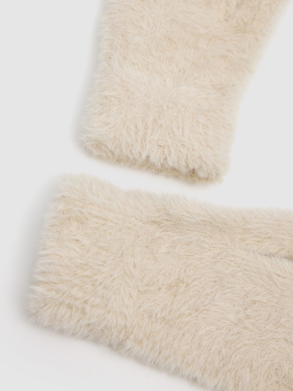 White fur gloves beige detail view