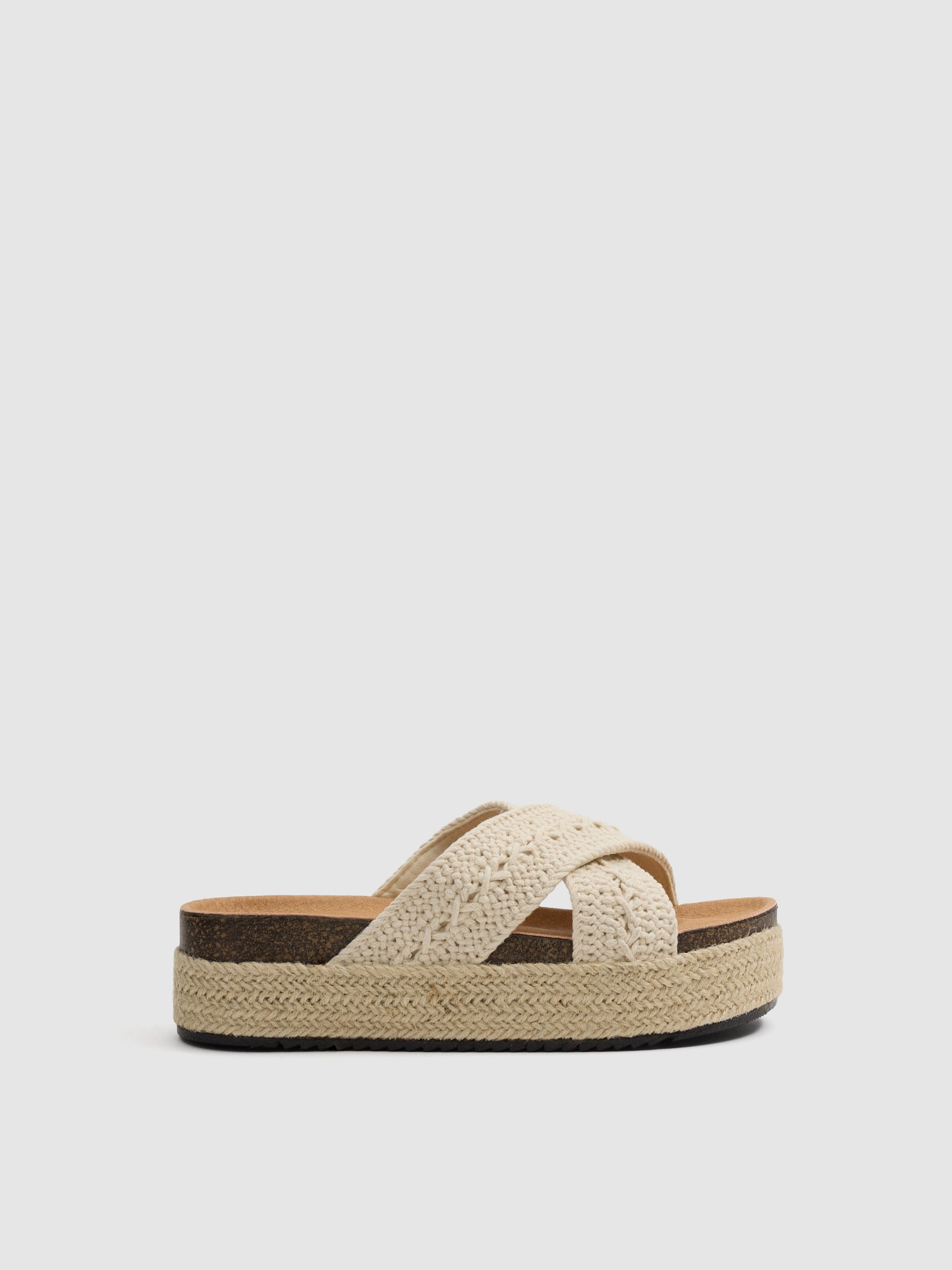 Platform sandals with crossed crochet straps off white