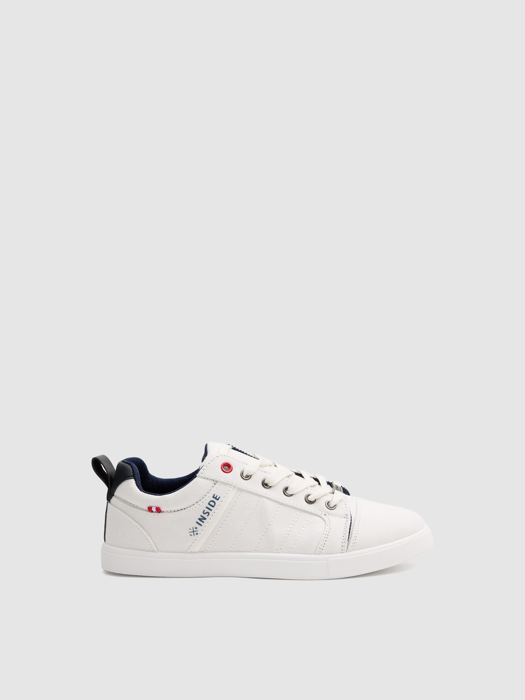 White canvas sneakers white profile view