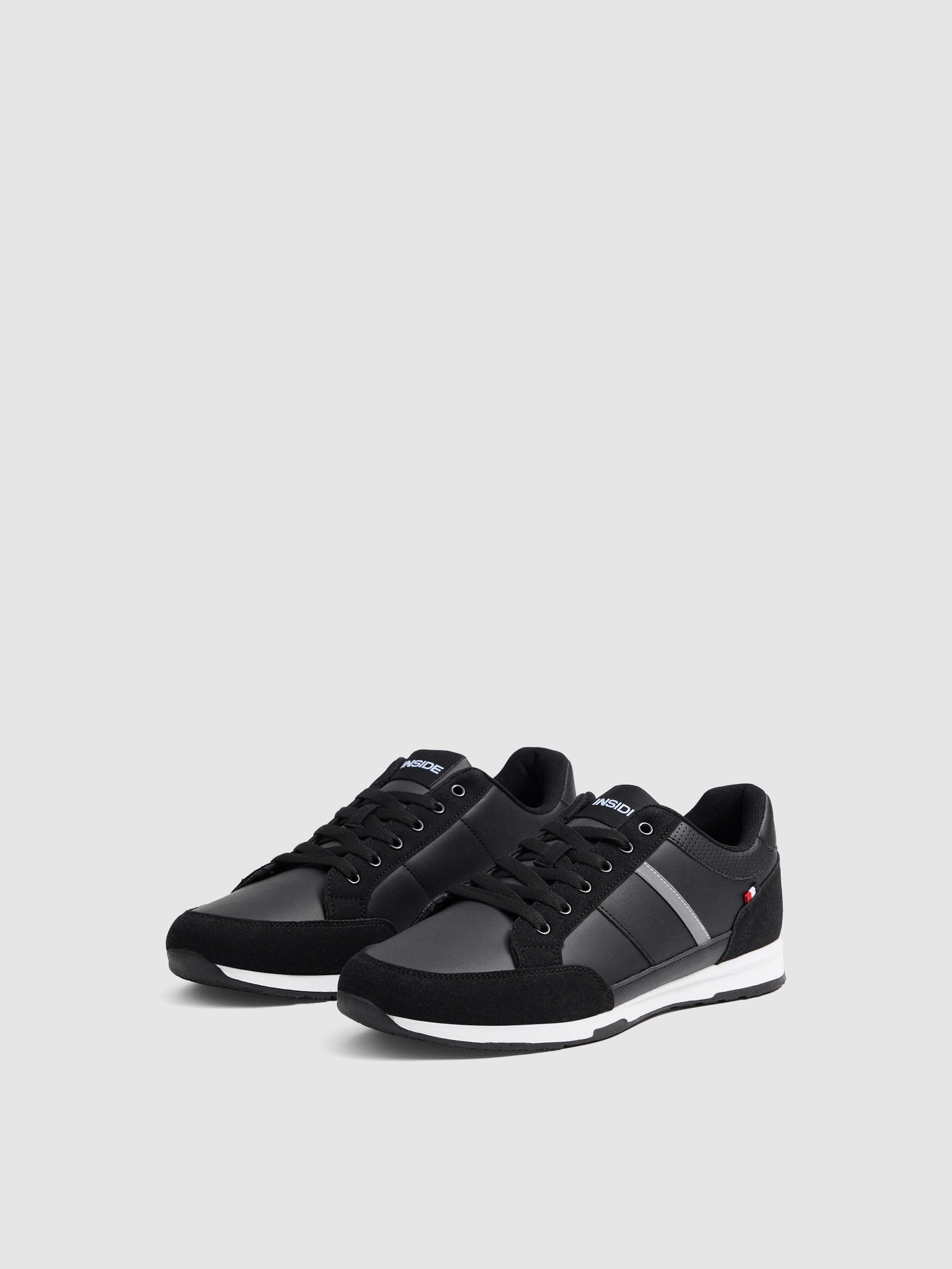 Zapatillas básicas con franja negro/beige vista perfil