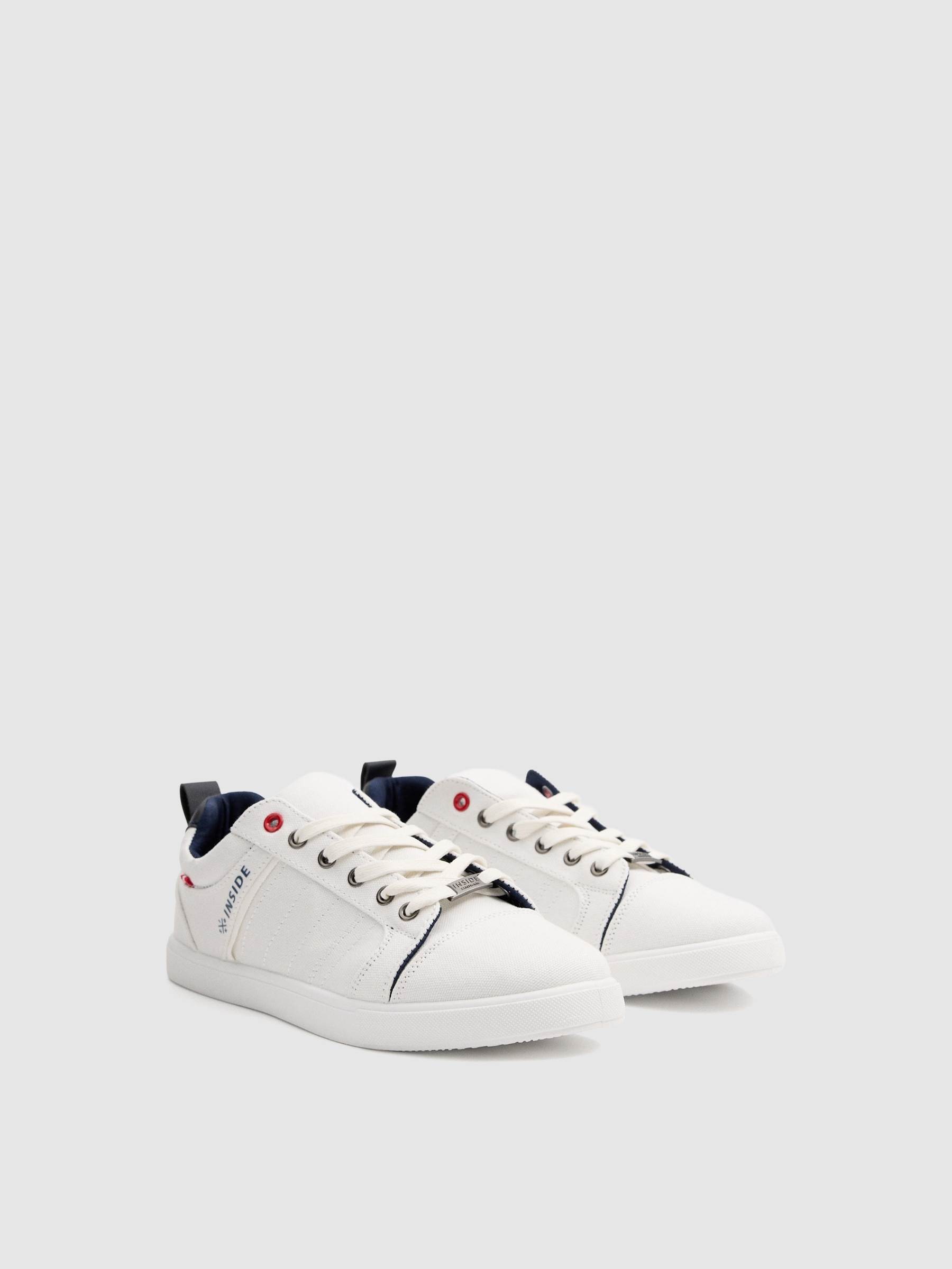 White canvas sneakers white profile view