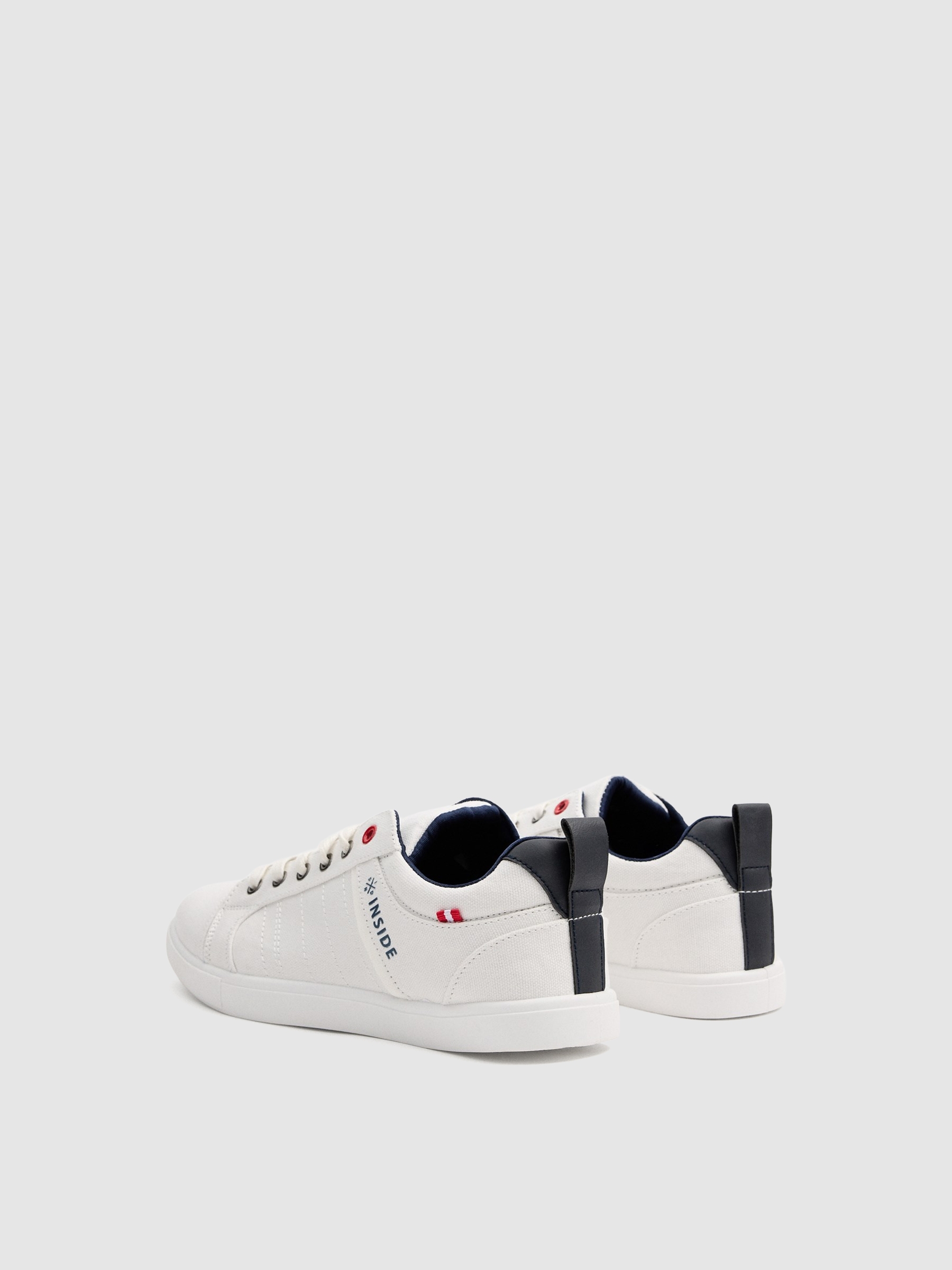 Tênis de lona brancos branco vista perfil