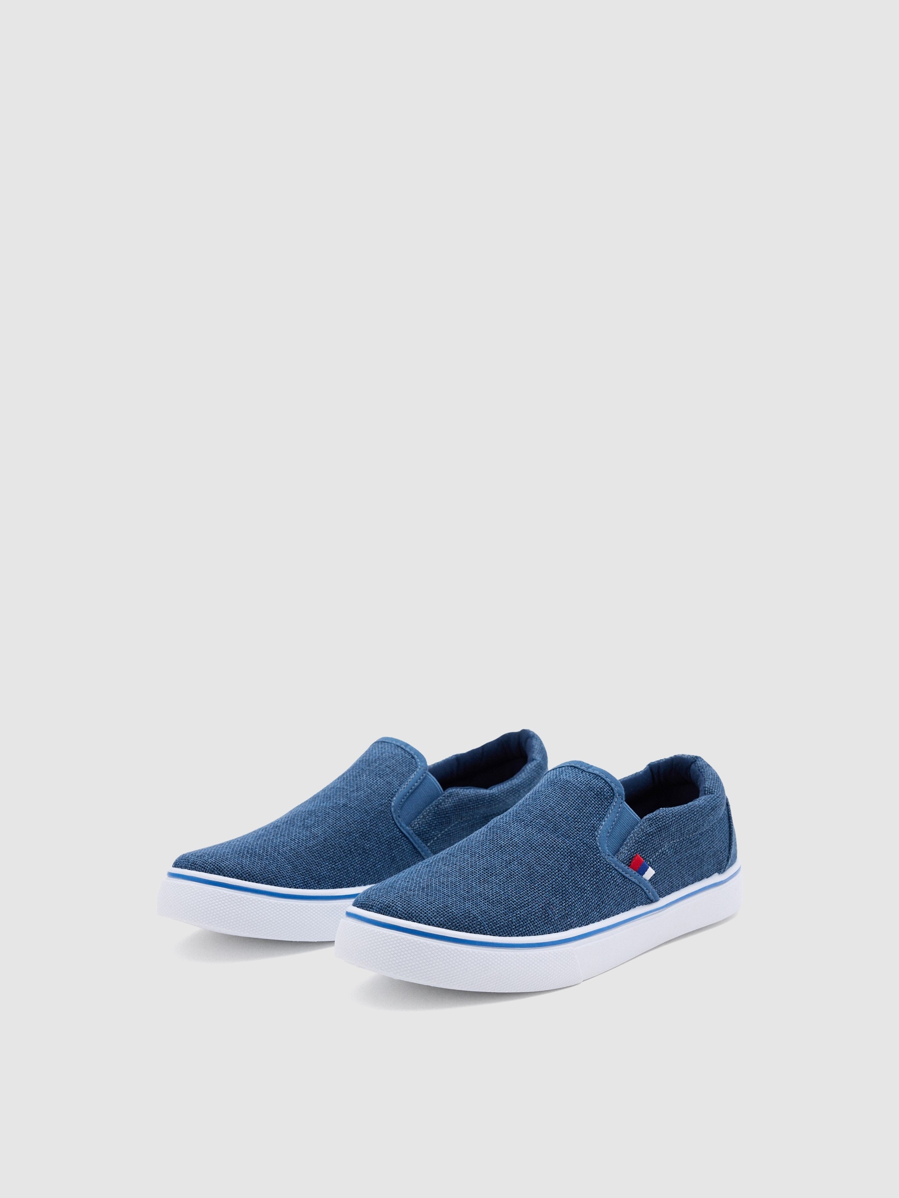 Blue canvas slip-on sneaker indigo blue profile view