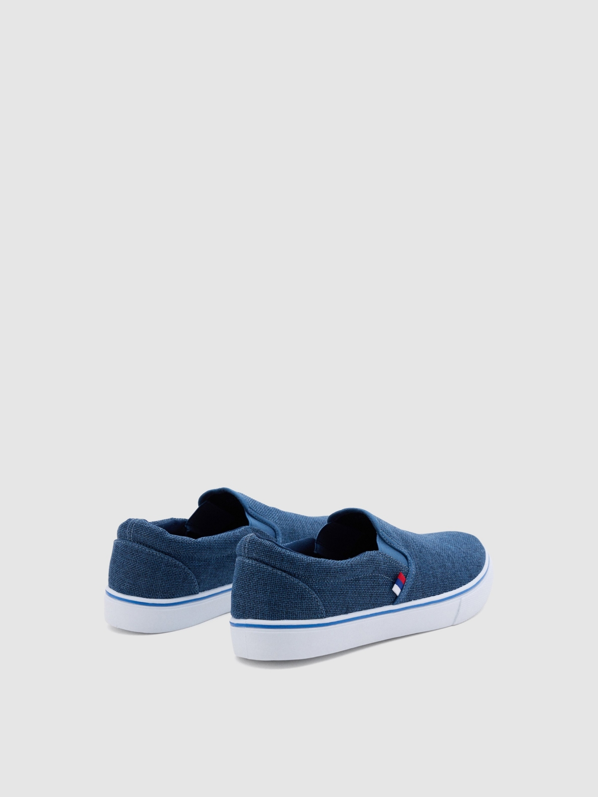 Blue canvas slip-on sneaker indigo blue 45º back view