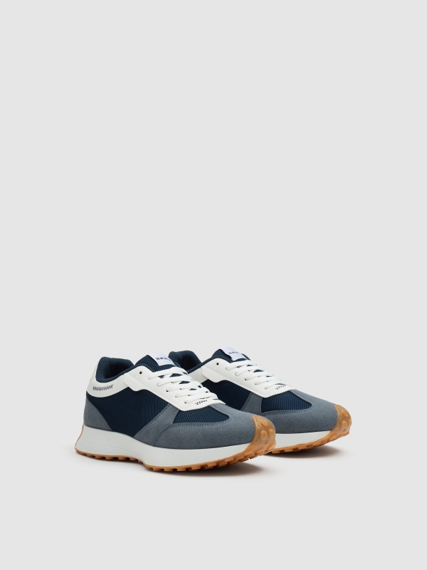 Tênis casuais baixos azul combinado azul escuro vista frontal 45º