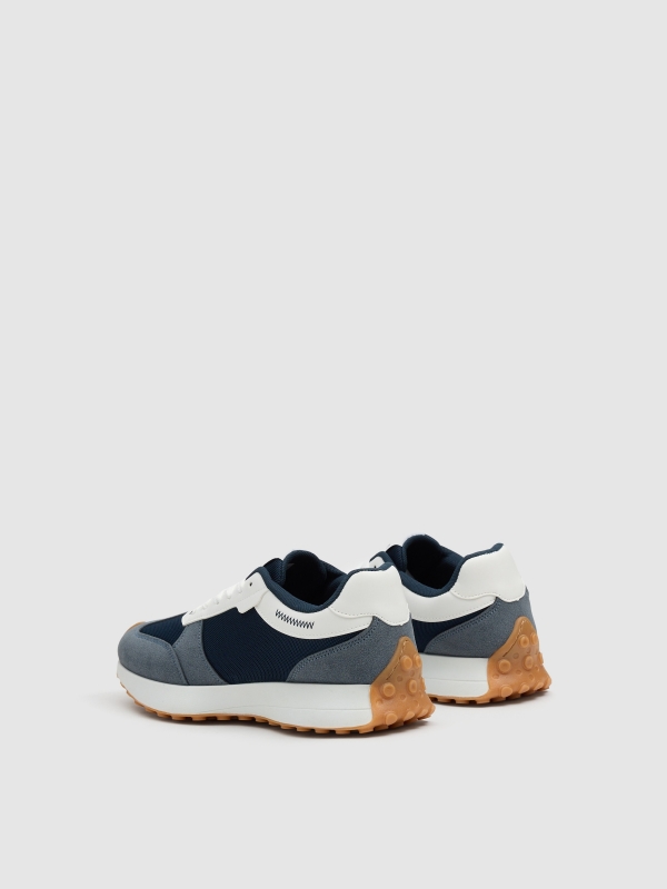 Low casual sneakers blue combined dark blue 45º back view