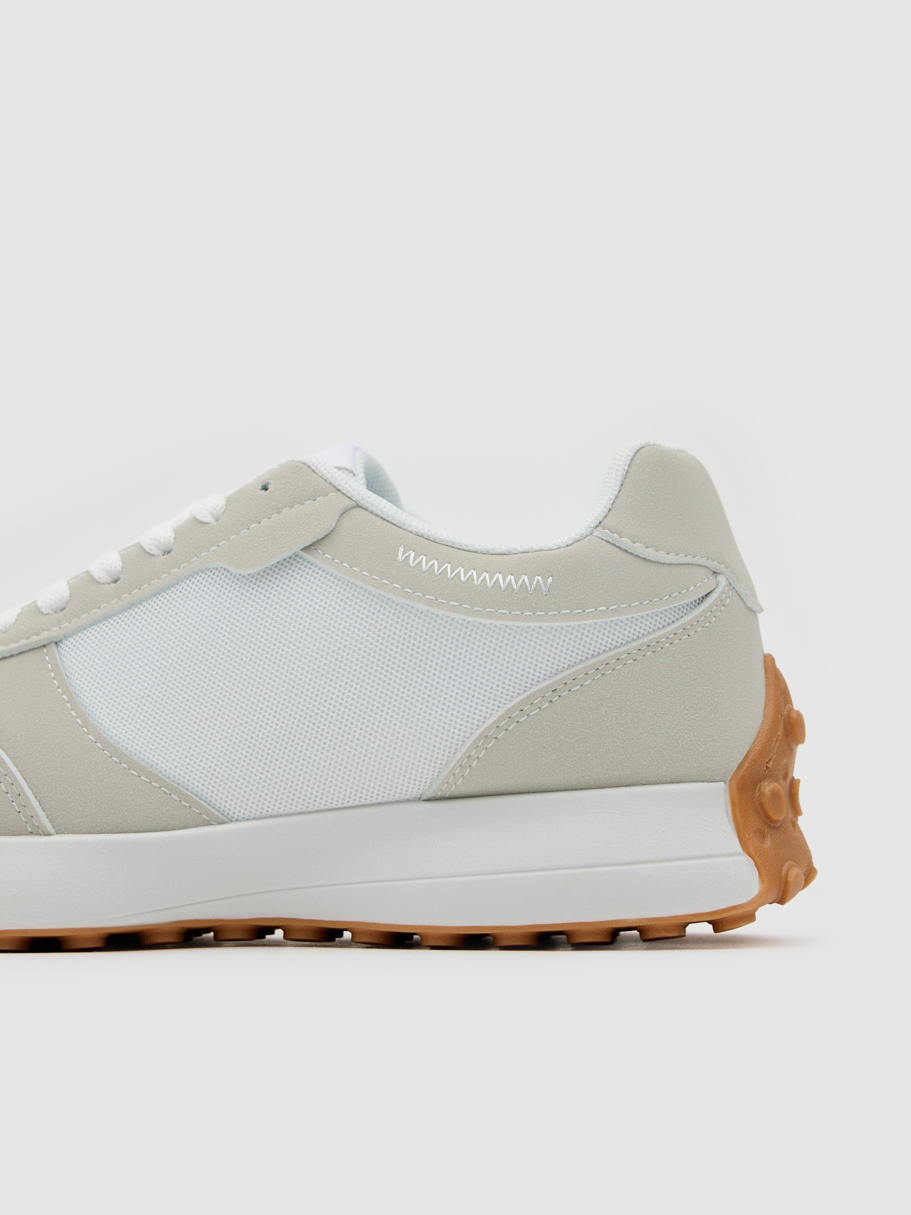 Nylon and rubber running shoes white