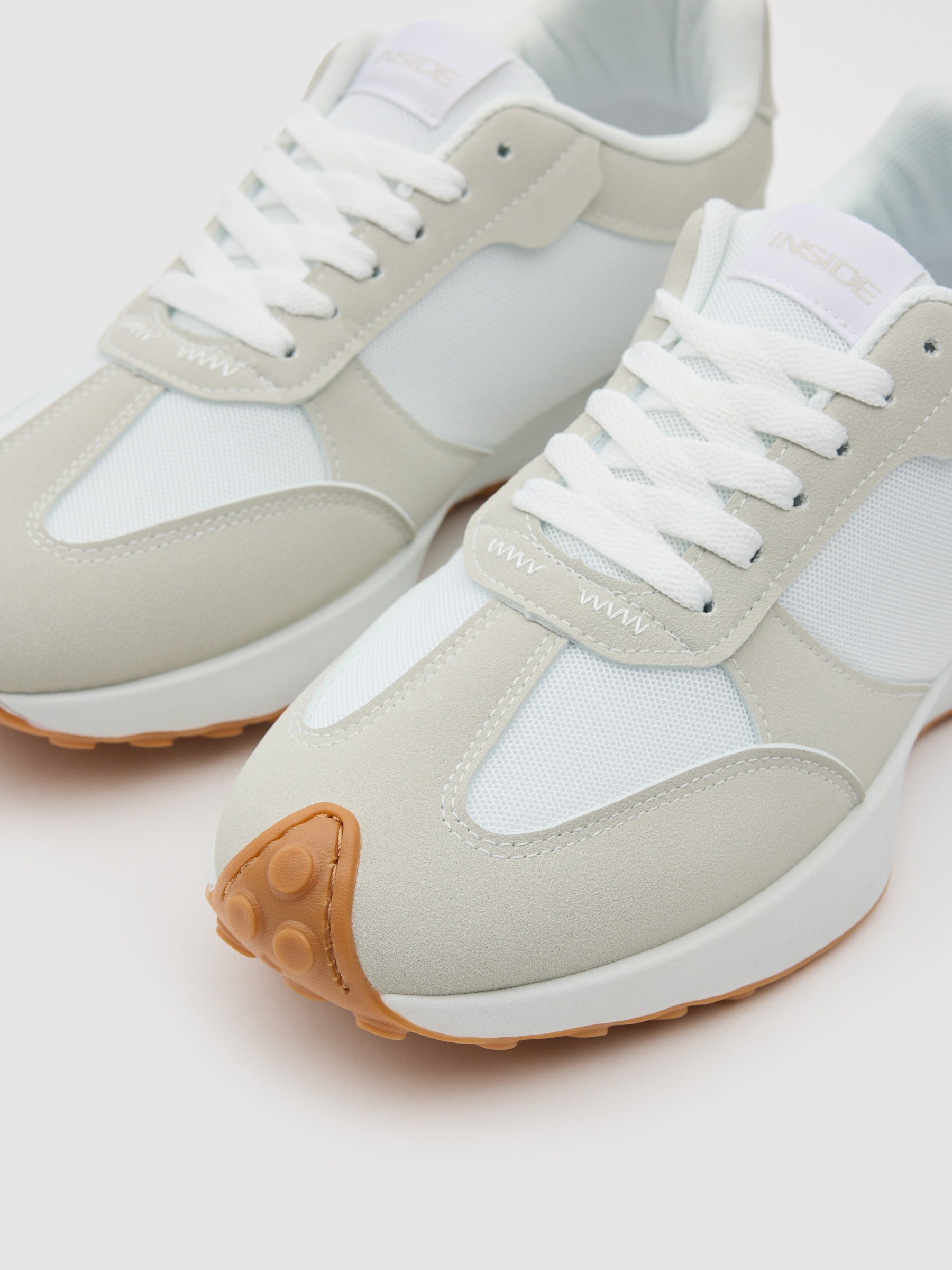 Nylon and rubber running shoes white