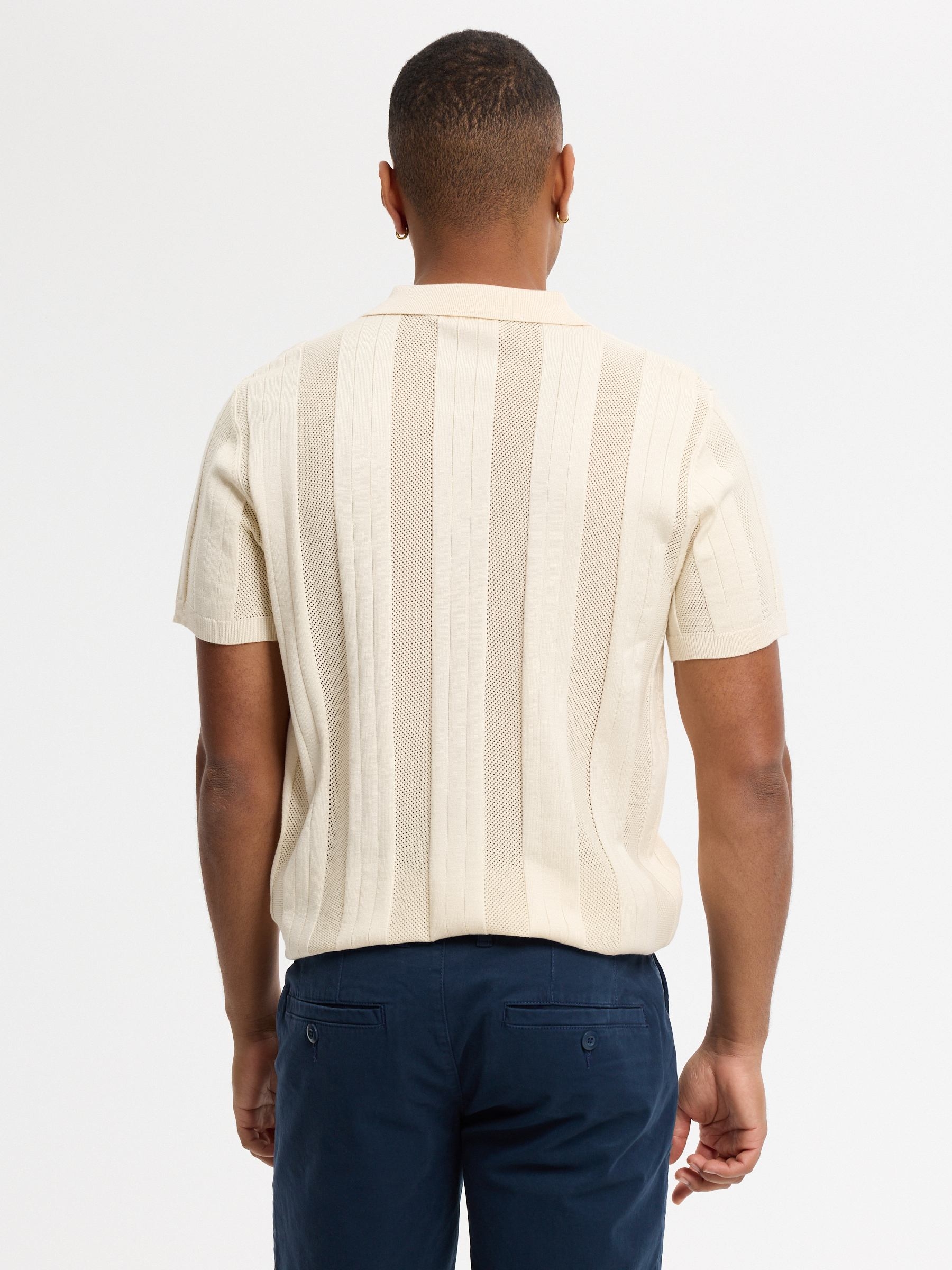 Knitted polo shirt with buttons raw middle front view