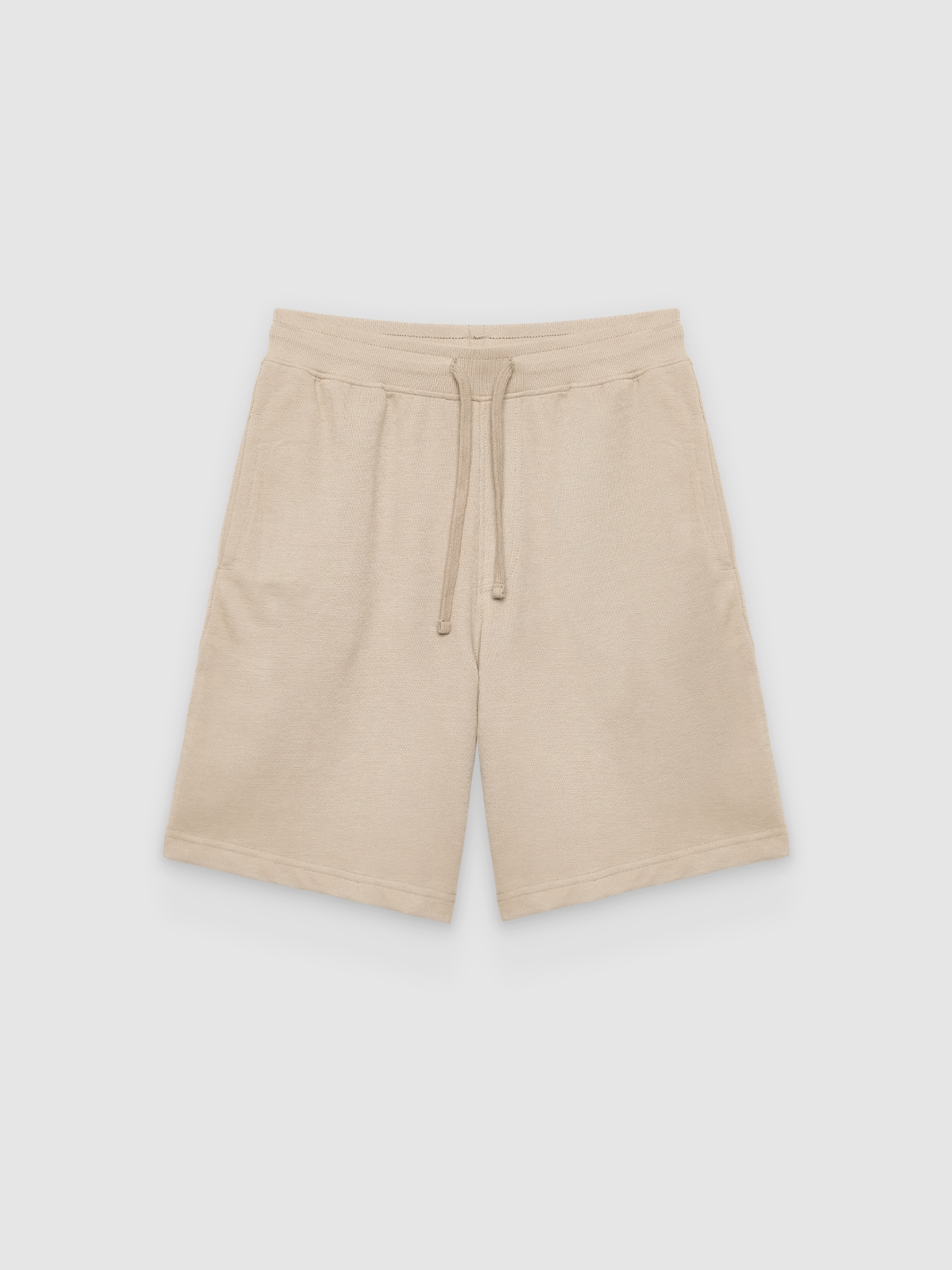 Bermuda deportiva de felpa beige vista media frontal