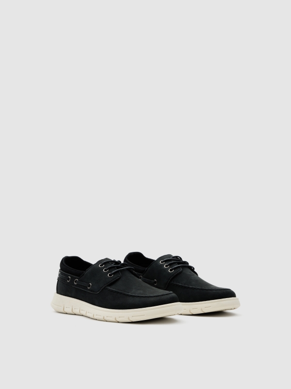 Boat shoe made of faux leather with rubber sole black 45º front view