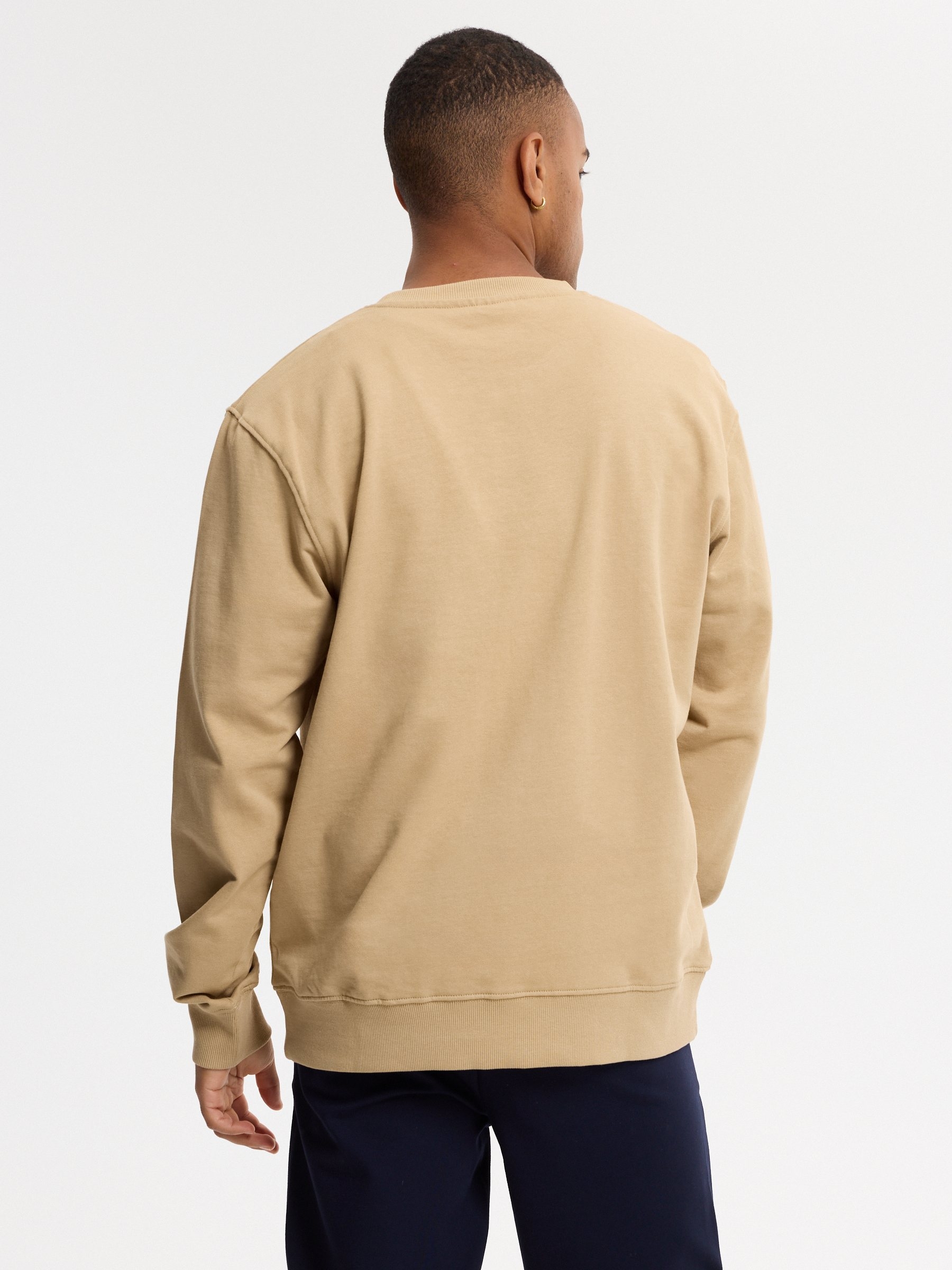 Sudadera texto bordado oversize beige vista media frontal