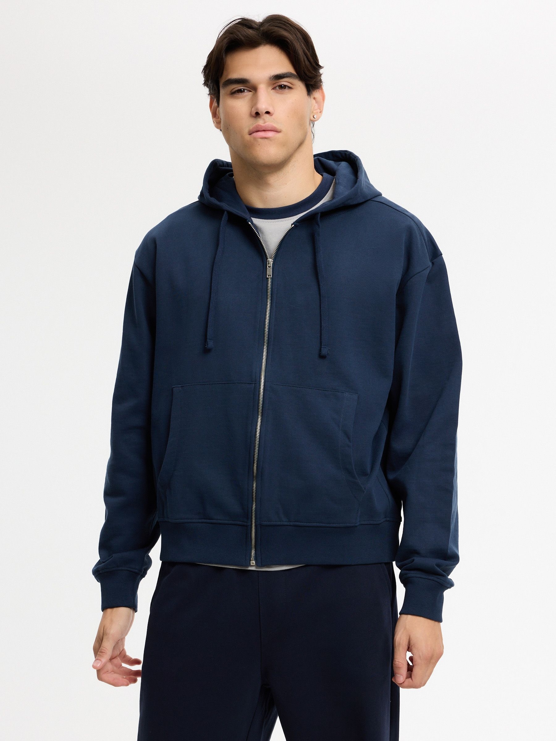 Moletom oversized com zíper e capuz azul marinho vista meia frontal