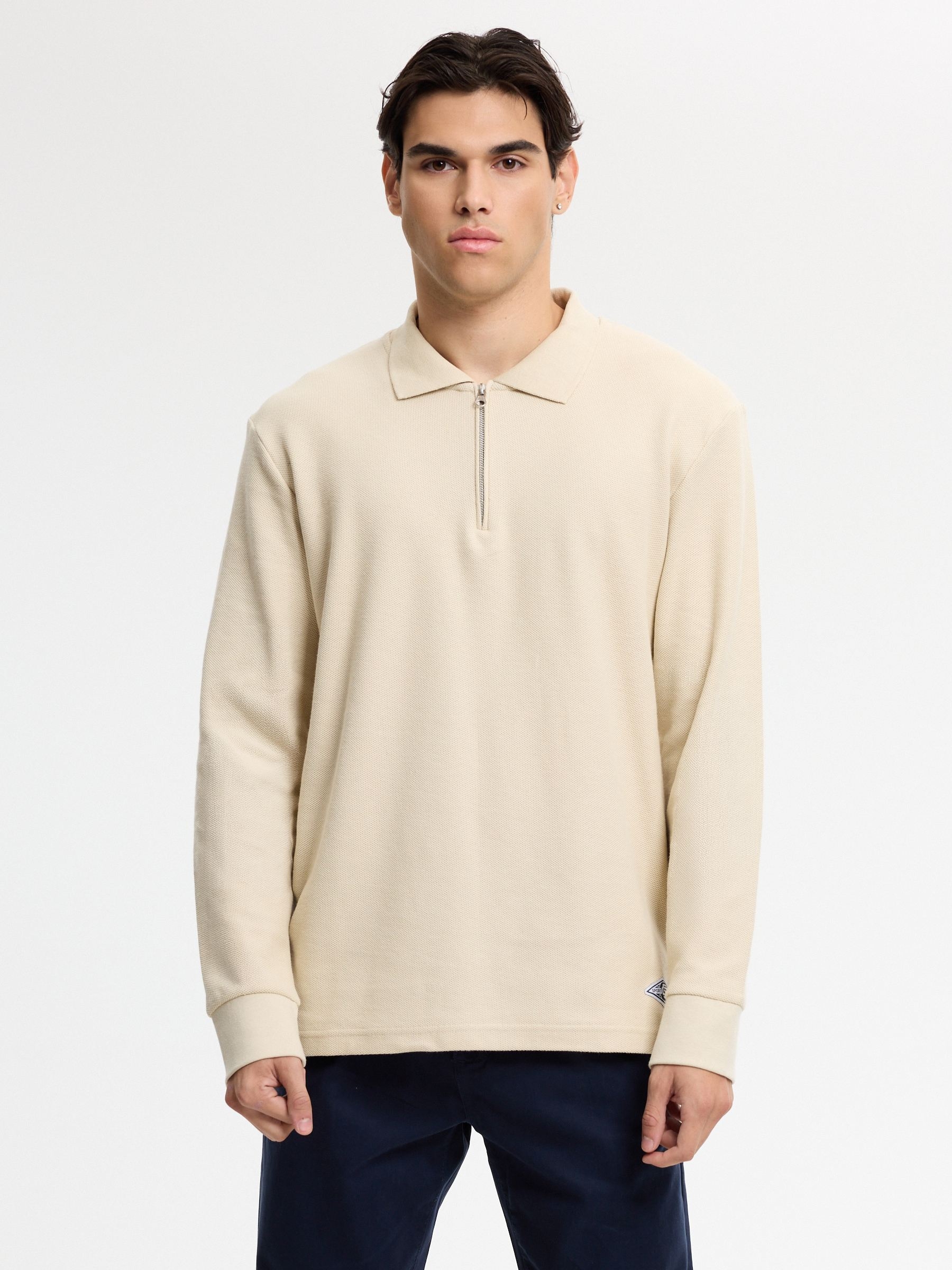 Polo oversized de manga longa liso crua vista meia frontal