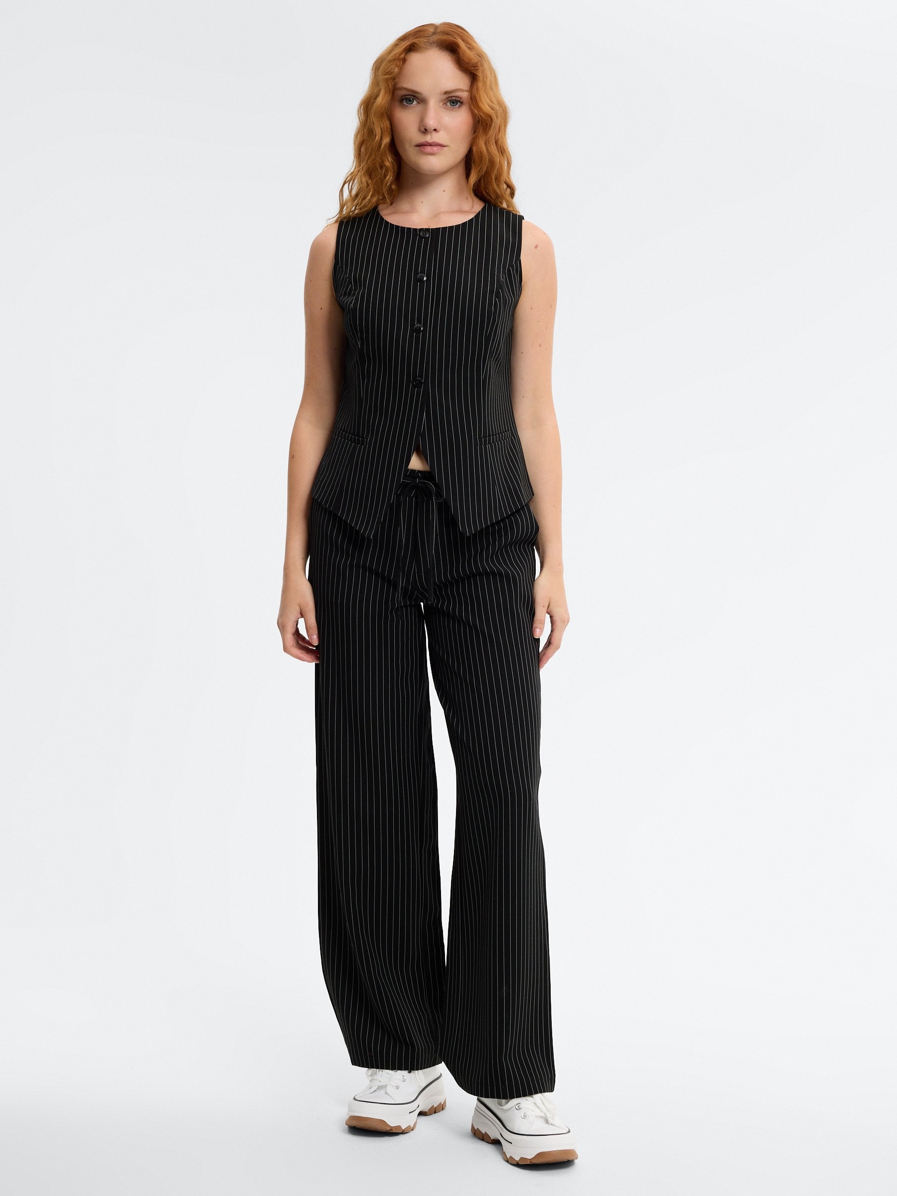 Flowy pinstripe pants black front view