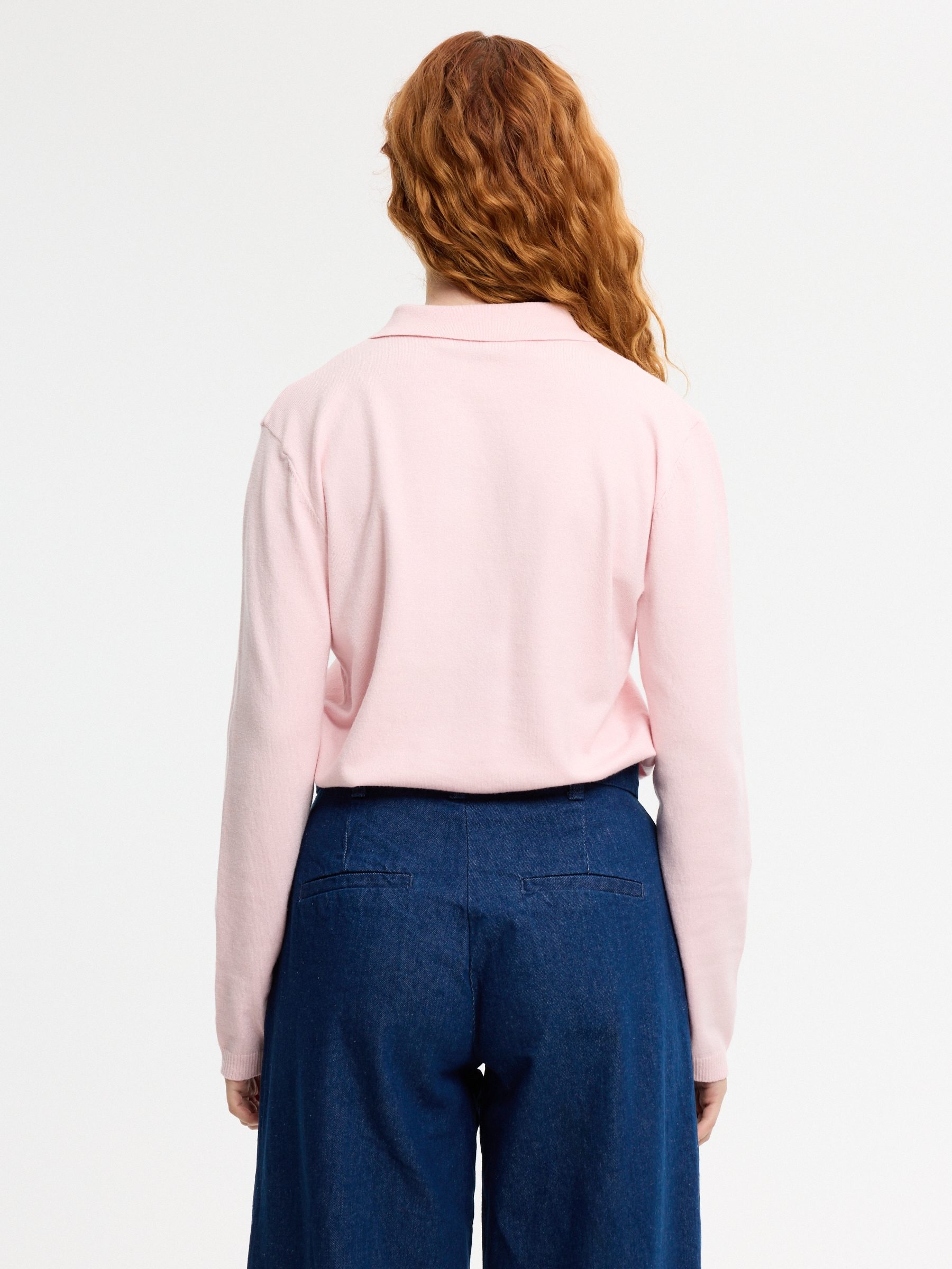 Knitted polo sweater with buttons light pink middle front view
