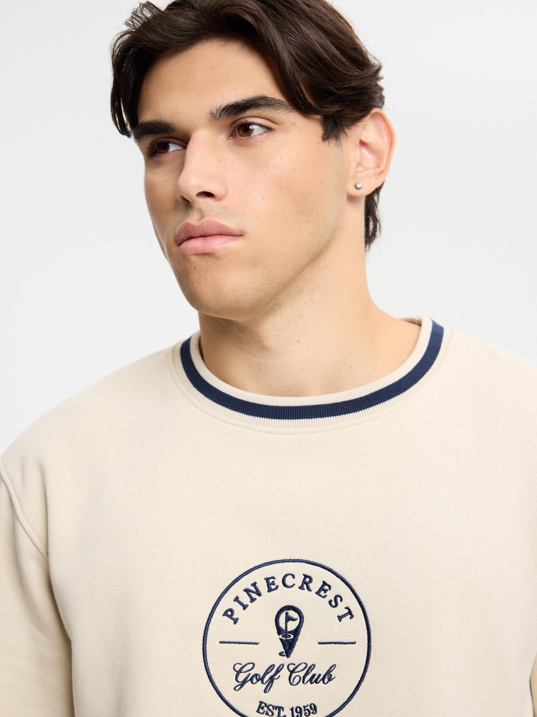 Embroidered oversized golf club sweatshirt raw middle front view