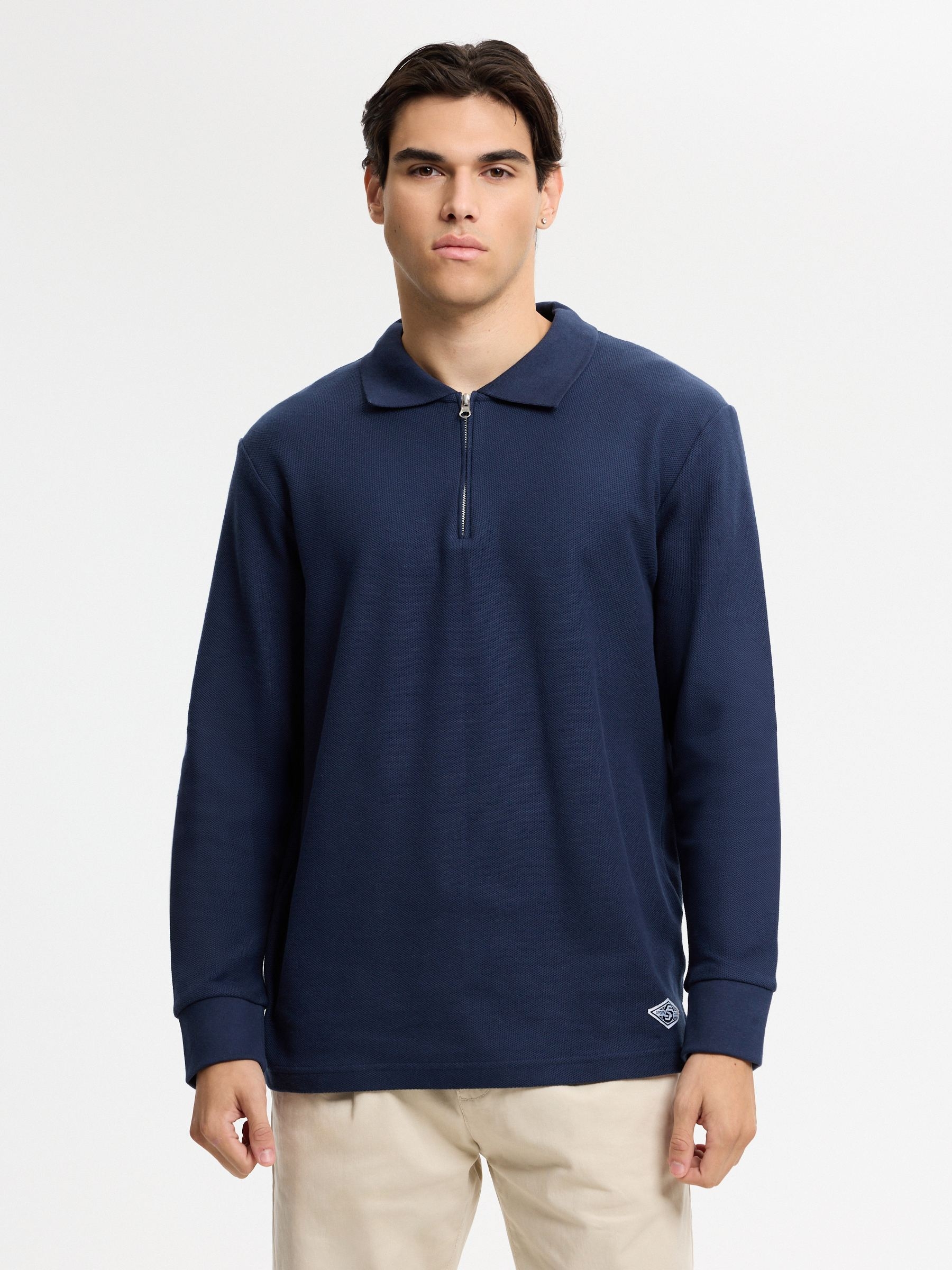 Polo oversized de manga longa liso azul marinho vista meia frontal