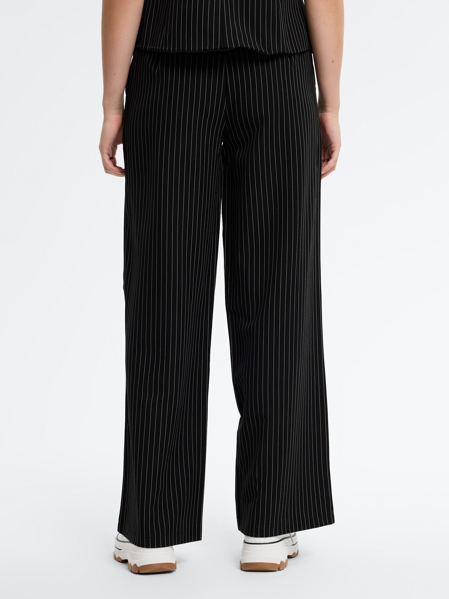 Flowy pinstripe pants black front view