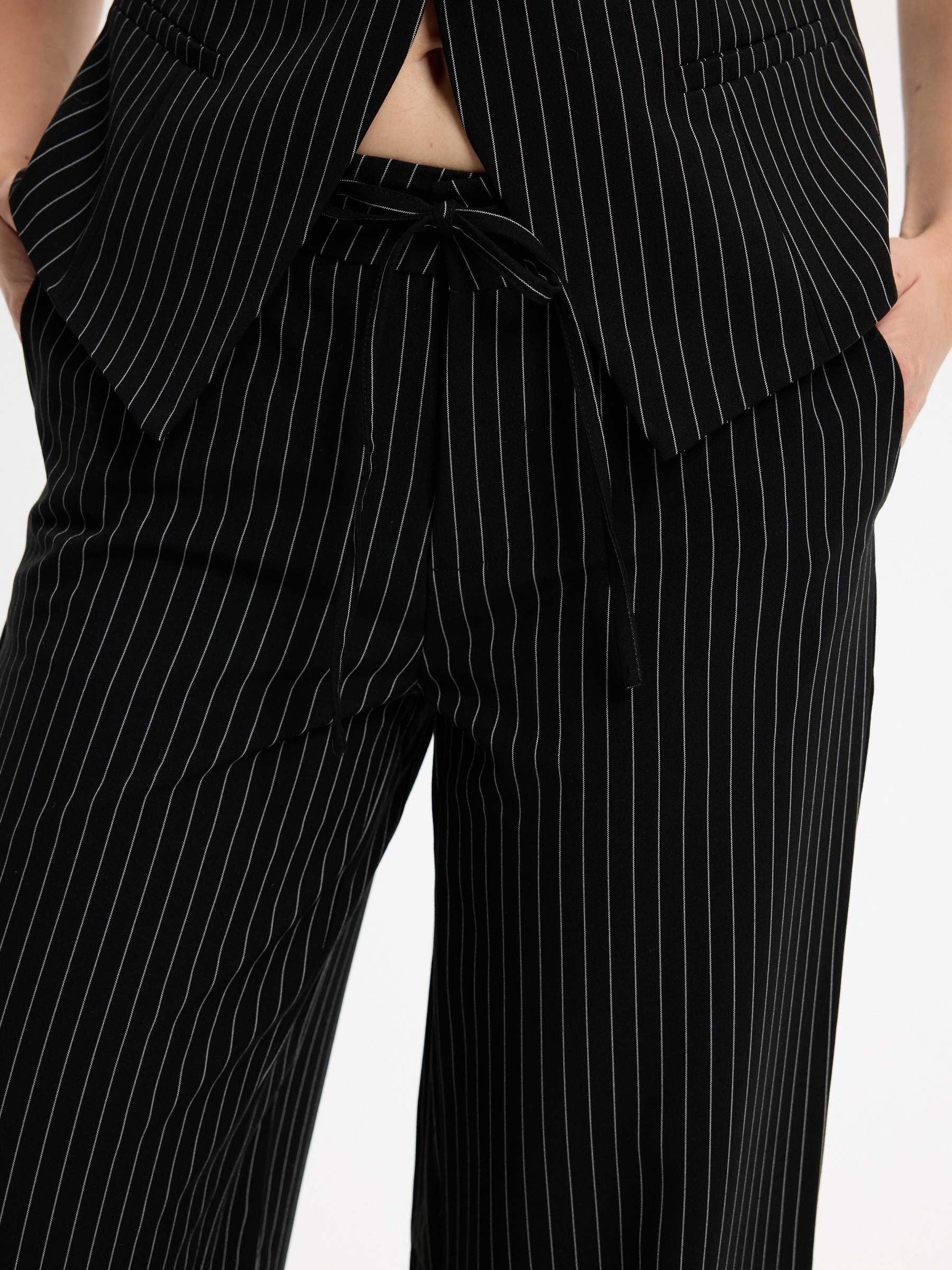 Flowy pinstripe pants black front view