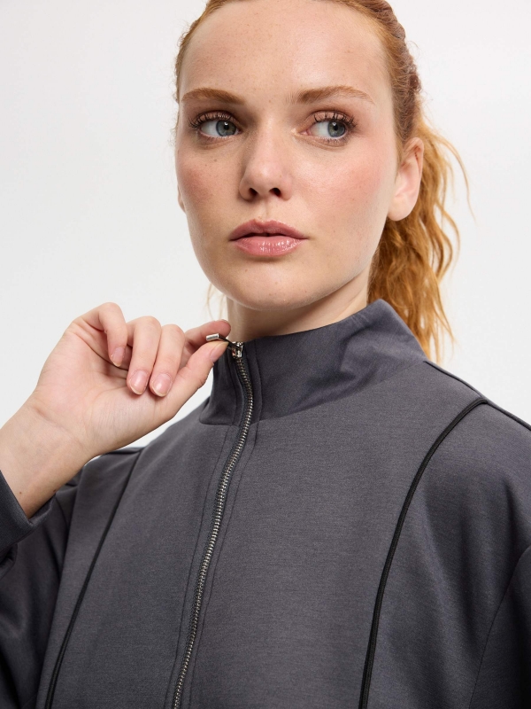 Soft zip-up jacket with high collar dark grey detail view