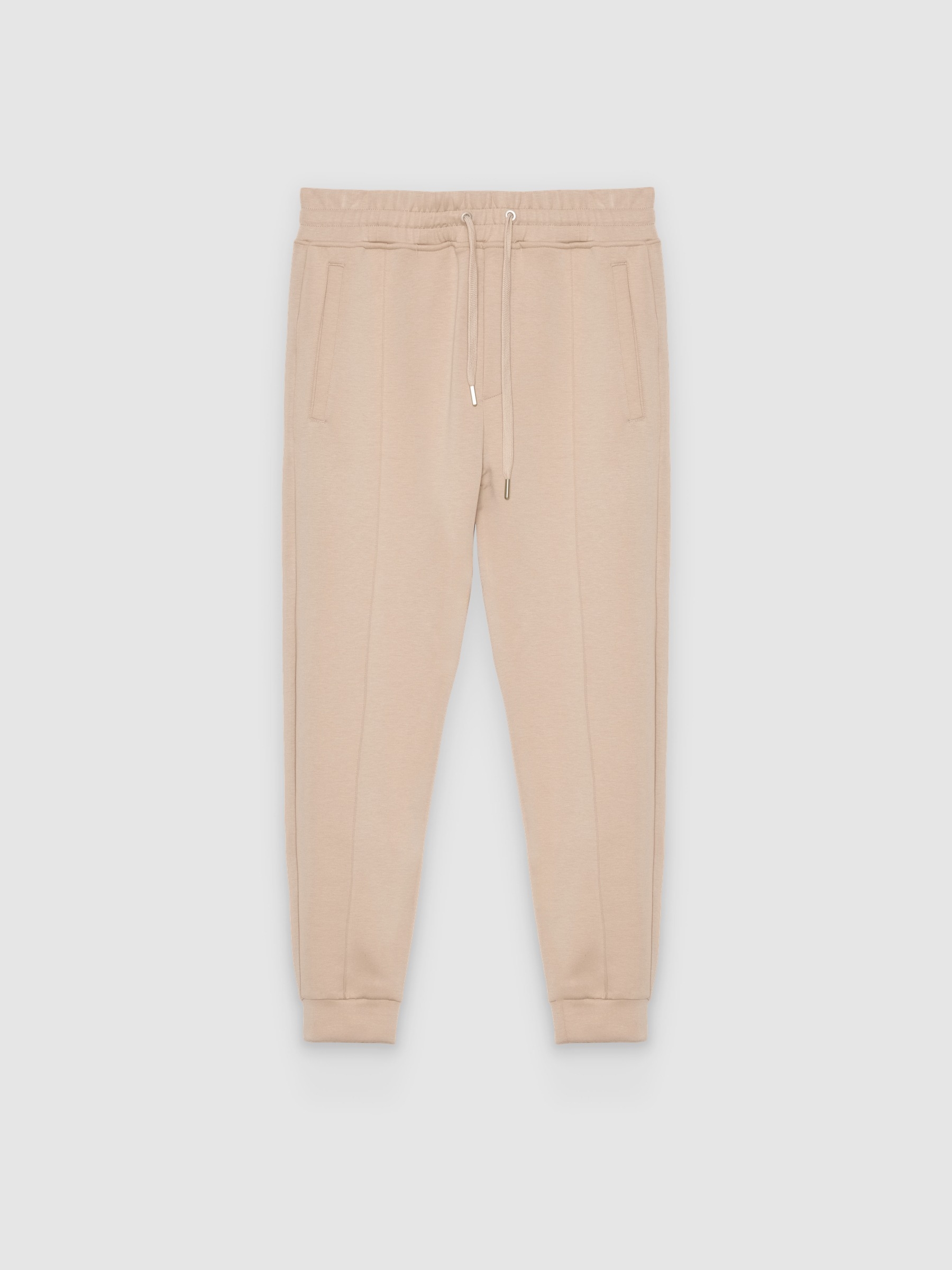 Pantalón jogger slim fit de felpa beige vista general frontal