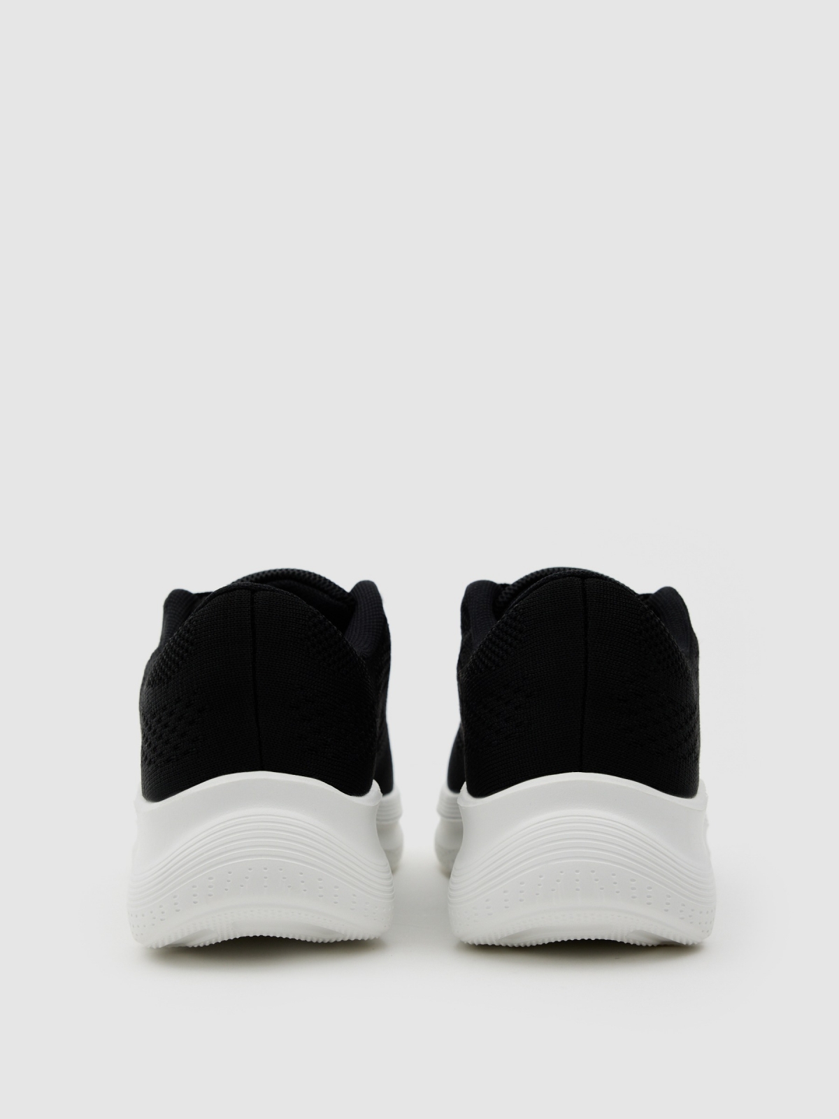 Black low-top platform sneakers black detail view