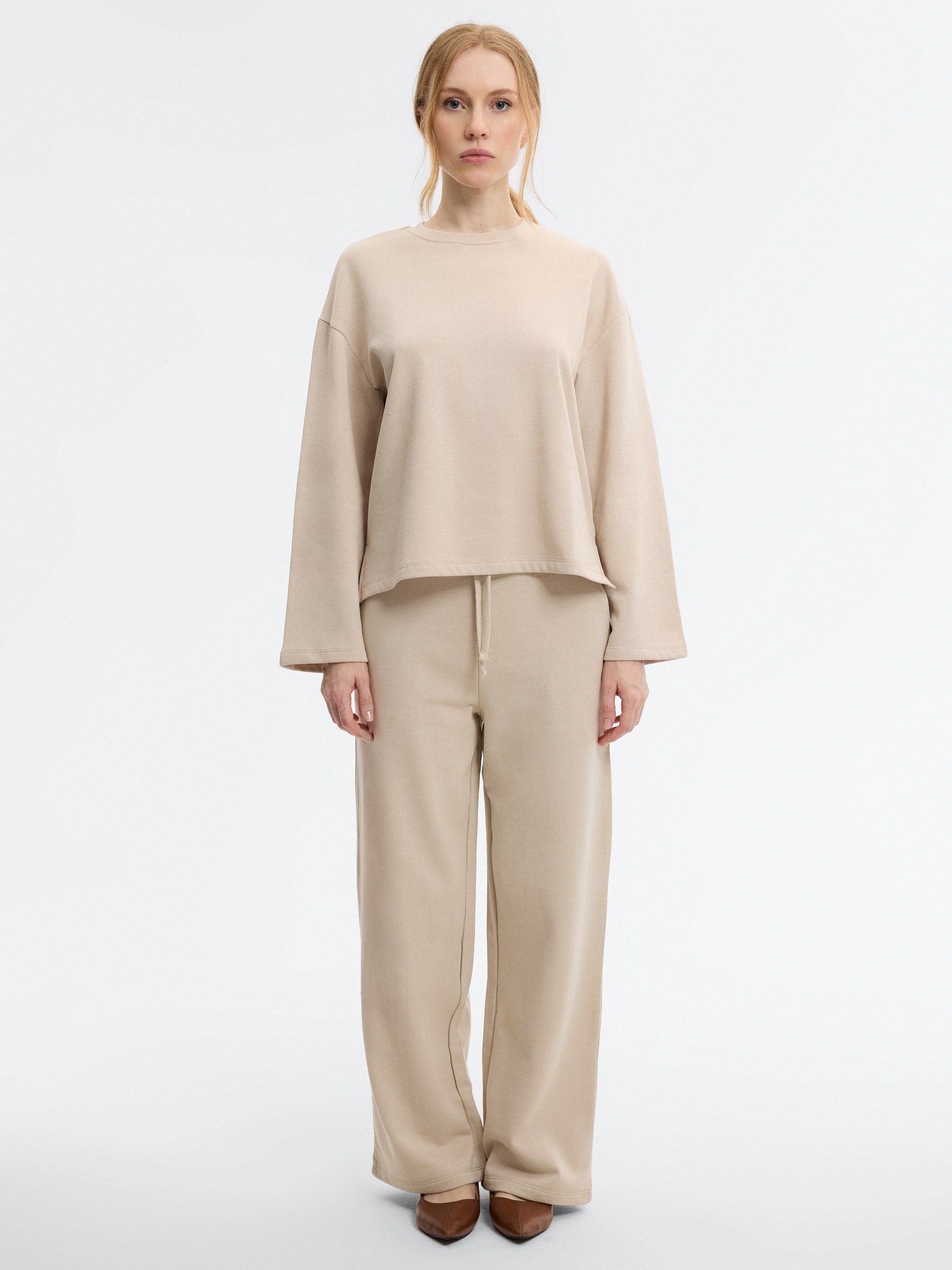 Pantalón chándal wide leg crudo vista general frontal
